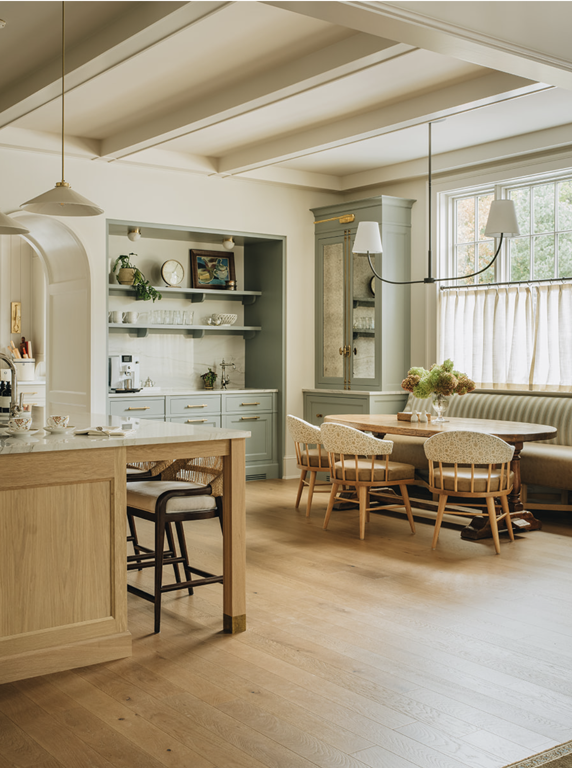 Interior Design: @jeanstofferdesign Build: @zahnbuildersinc Architecture: @jameslarew Photography: @stofferphotographyinteriors We hope you are having a great week–and are in the mood for touring a one-of-a-kind home designed by the talented Jean Stoffer Design and beautifully photographed by Stoffer Photography Interiors.  Neutral enough to be calm, textured enough to be interesting, and layered into complete coziness, this is the perfect home for friends and family. Beautiful kitchen with beams and blonde wood island