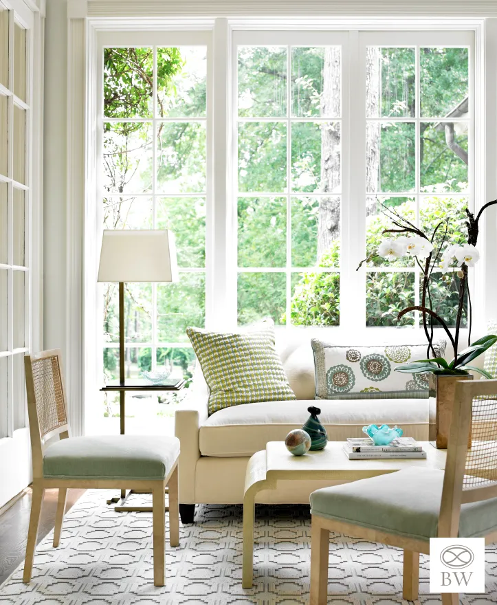 Beth Webb, one of our favorite designers and most frequented credits on Design Chic, is celebrated for her exceptional talent in interior design. Webb seamlessly blends timeless elegance with contemporary functionality, and these rooms are no exception. Emily Followill Photography - living room with large windows and decorative pillows