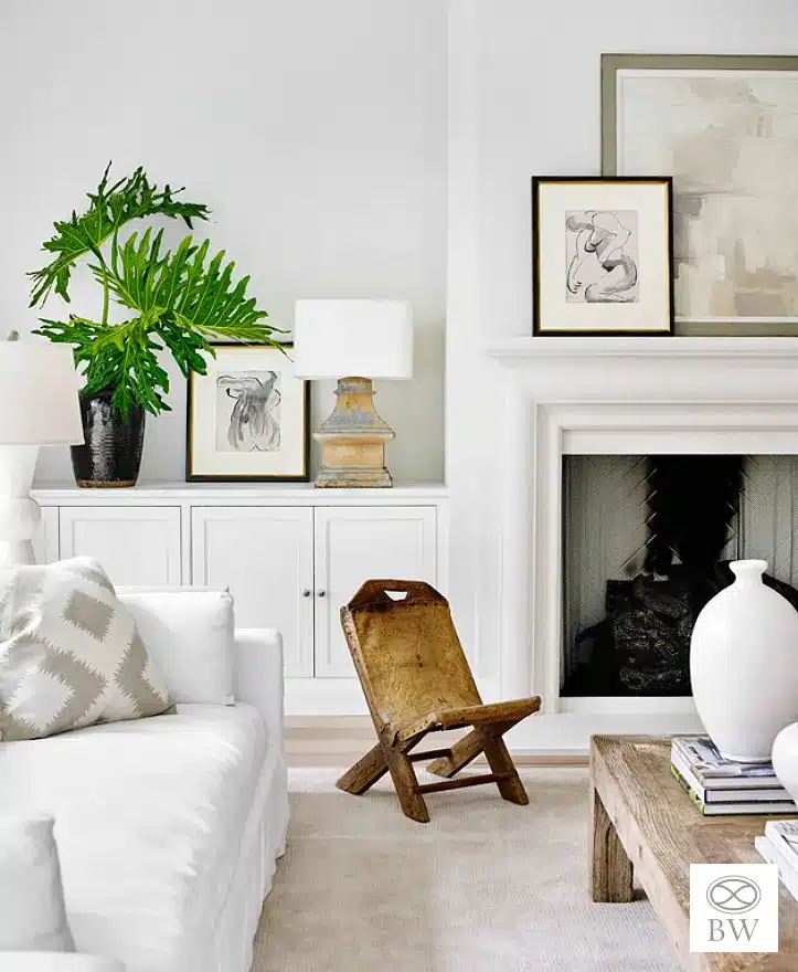 Beth Webb, one of our favorite designers and most frequented credits on Design Chic, is celebrated for her exceptional talent in interior design. Webb seamlessly blends timeless elegance with contemporary functionality, and these stunning living rooms are no exception. Emily Followill Photography - living room with applied molding and tufted sofa and round mirror - beautiful neutral decor with antique leather chair
