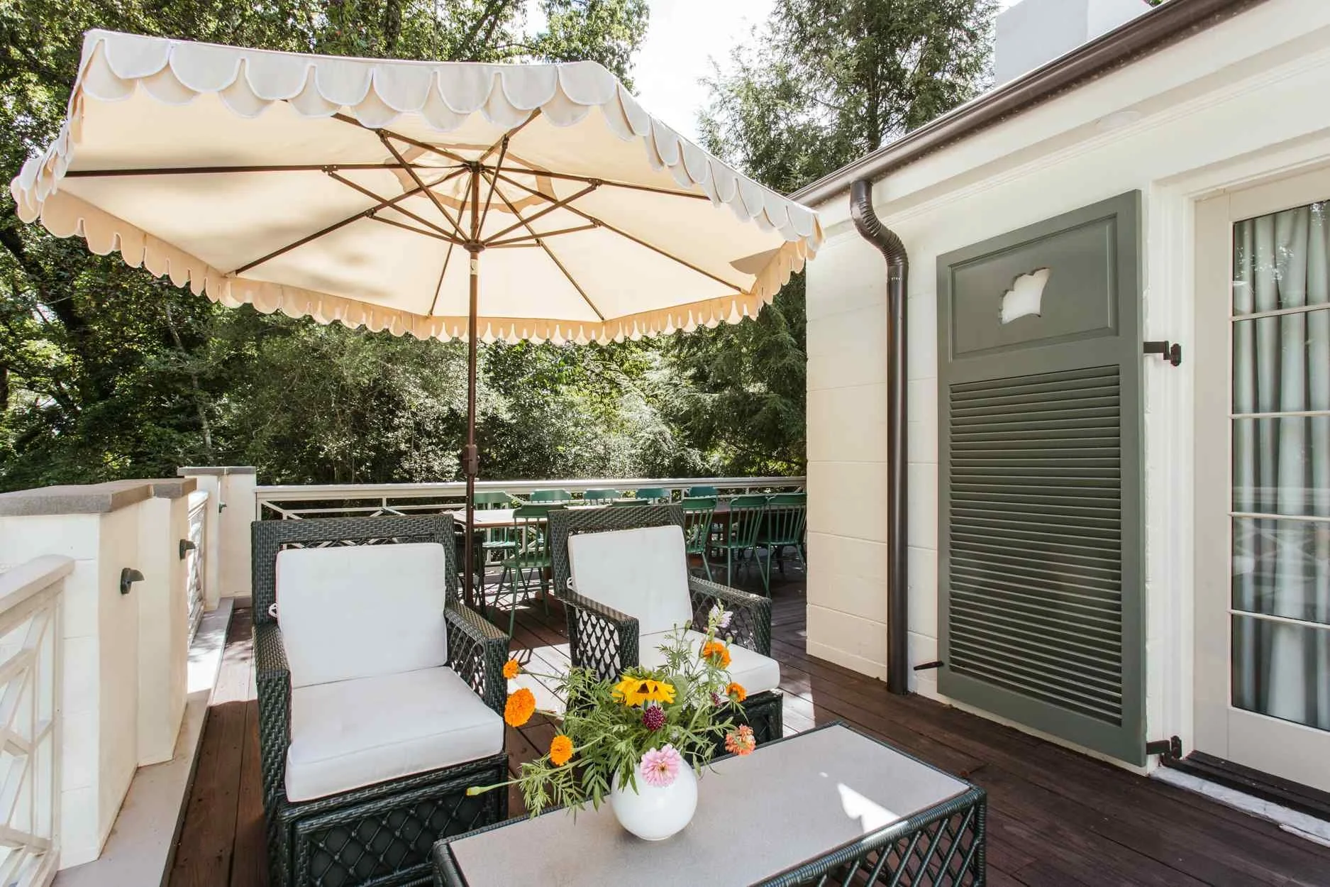 This beautiful home designed by The Misfit House and photographed by Kristin Karch Photography - beautiful patio with wicker furniture