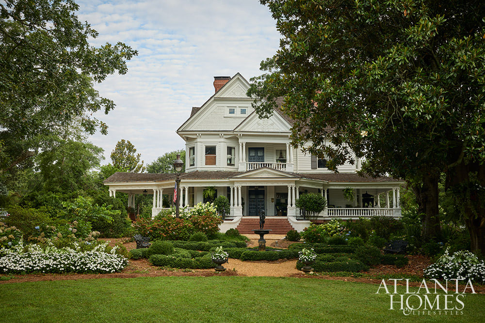 Dan Belman and Randy Korando, the owners of Atlanta's iconic Boxwoods Gardens & Gifts, transformed a historic Queen Anne home using maximalist decor ideas we love. In this style, texture, pattern, and color combine to create this "more is more" approach. From the stunning architectural details to the well-placed accessories, every element is perfection, inside and out!