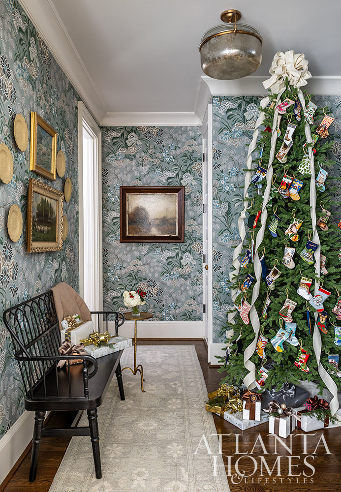 As the holiday celebrations begin to take center stage, we hope you can steal away for a moment to take a peek at this gorgeous Atlanta home. The stunning interior design ideas may inspire your own decorating.   Gallery wall in hallway with wooden bench Source: Atlanta Homes & Lifestyles  Interior Design: Lauren Davenport, Davenport Designs  Contractor:Matthew Morris, M.T. Morris Construction  Jeff Herr Photography 