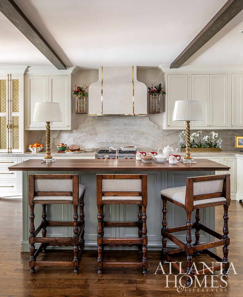 As the holiday celebrations begin to take center stage, we hope you can steal away for a moment to take a peek at this gorgeous Atlanta home. The stunning interior design ideas may inspire your own decorating.  White kitchen with brass hardware and wood island counterop Source: Atlanta Homes & Lifestyles  Interior Design: Lauren Davenport, Davenport Designs  Contractor:Matthew Morris, M.T. Morris Construction  Jeff Herr Photography 