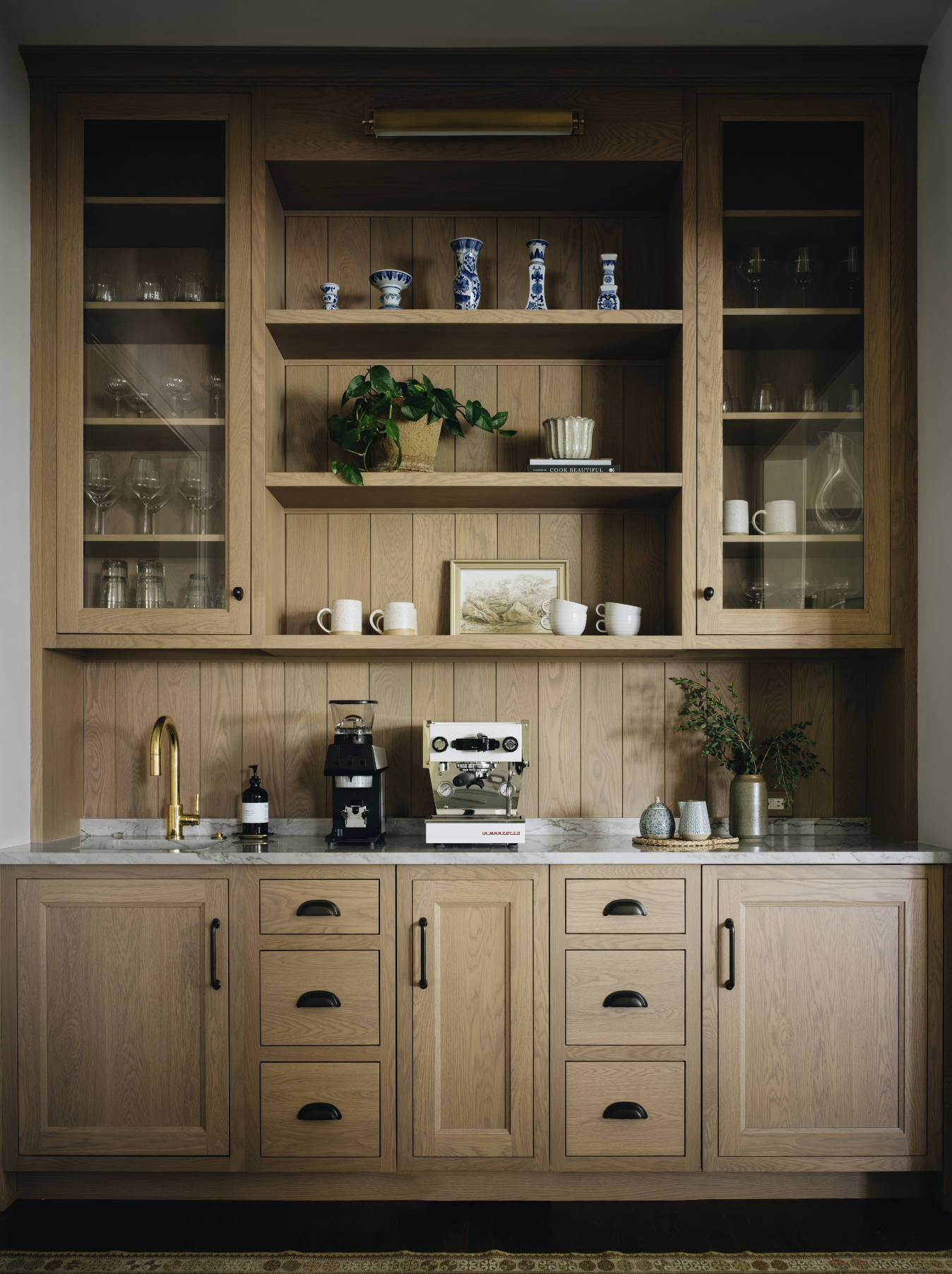 Designing a small coffee bar within your kitchen can add both functionality and charm to your space. Jean Stoffer Design | Stoffer Photography Interiors