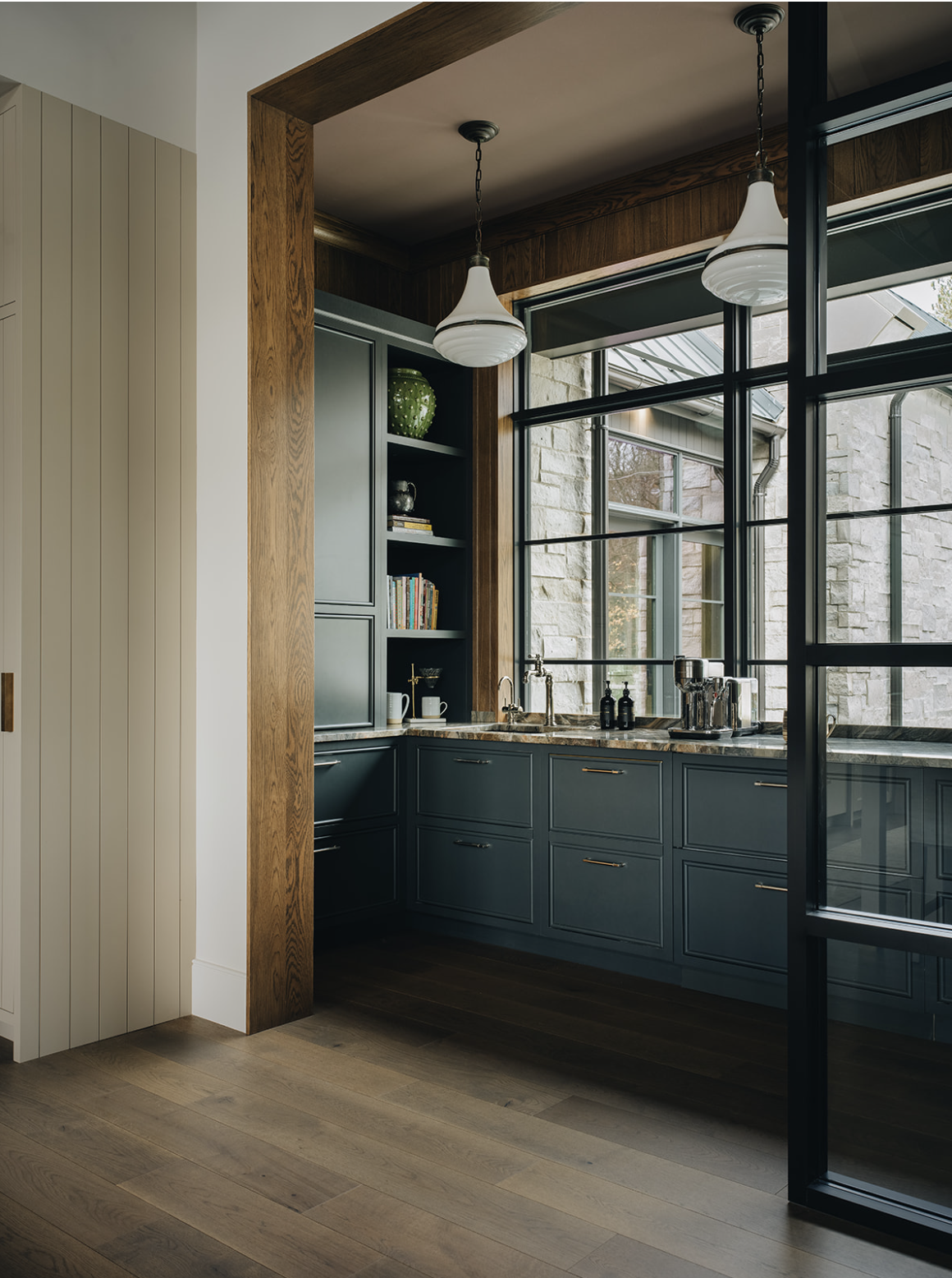 Designing a small coffee bar within your kitchen can add both functionality and charm to your space. Jean Stoffer Design | Stoffer Photography Interiors