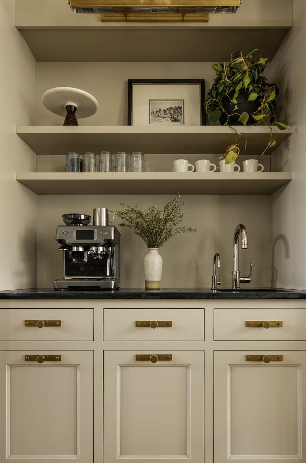 Designing a small coffee bar within your kitchen can add both functionality and charm to your space. Jean Stoffer Design | Stoffer Photography Interiors