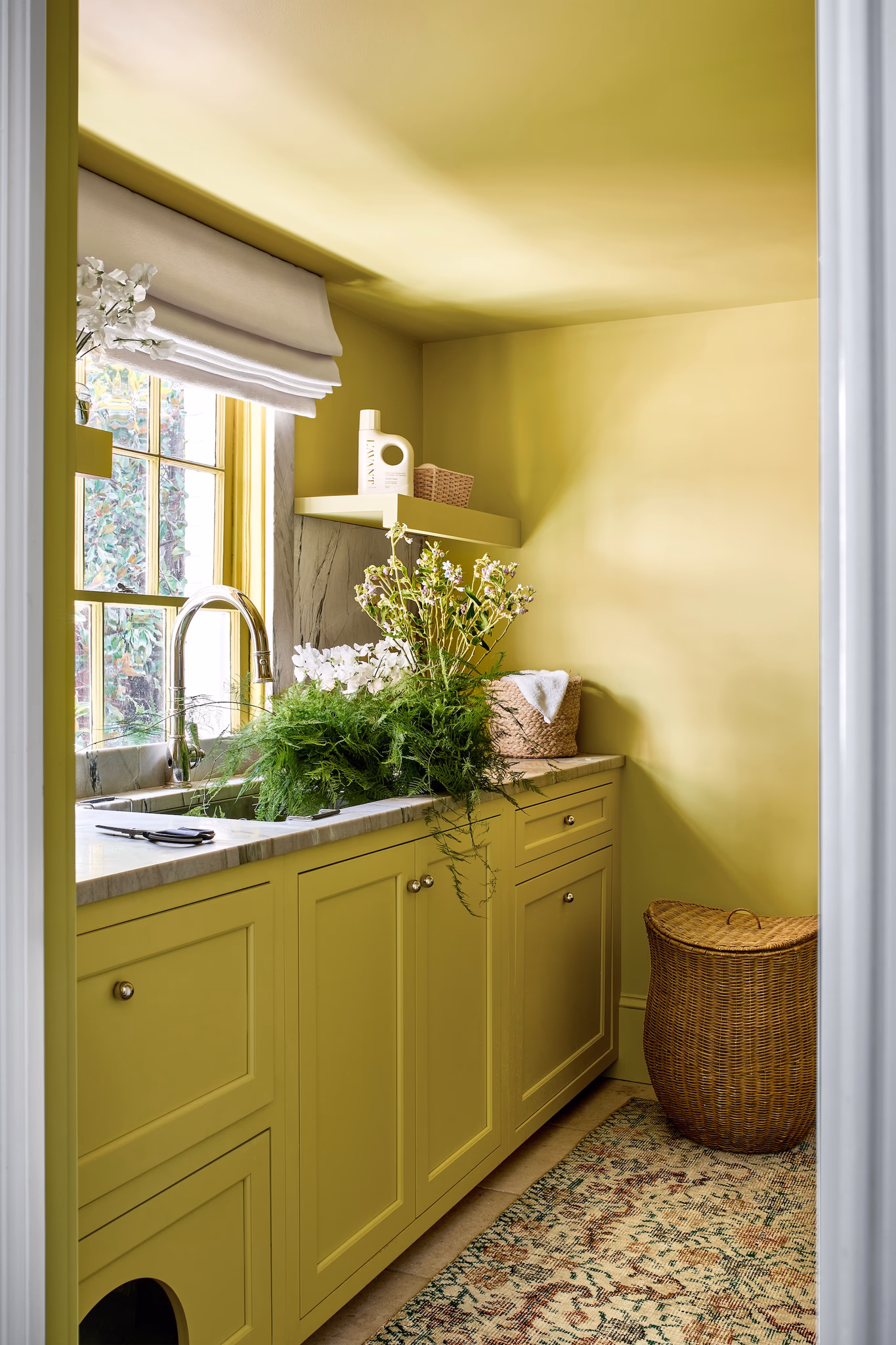 Rich, earthy colors, layered textures and rooms that tell a story - . This historic Georgetown row house designed by Zoe Feldman has us daydreaming about adding a few of these trends to our own homes. Stacy Zarin Goldberg Photography - yellow laundry room
