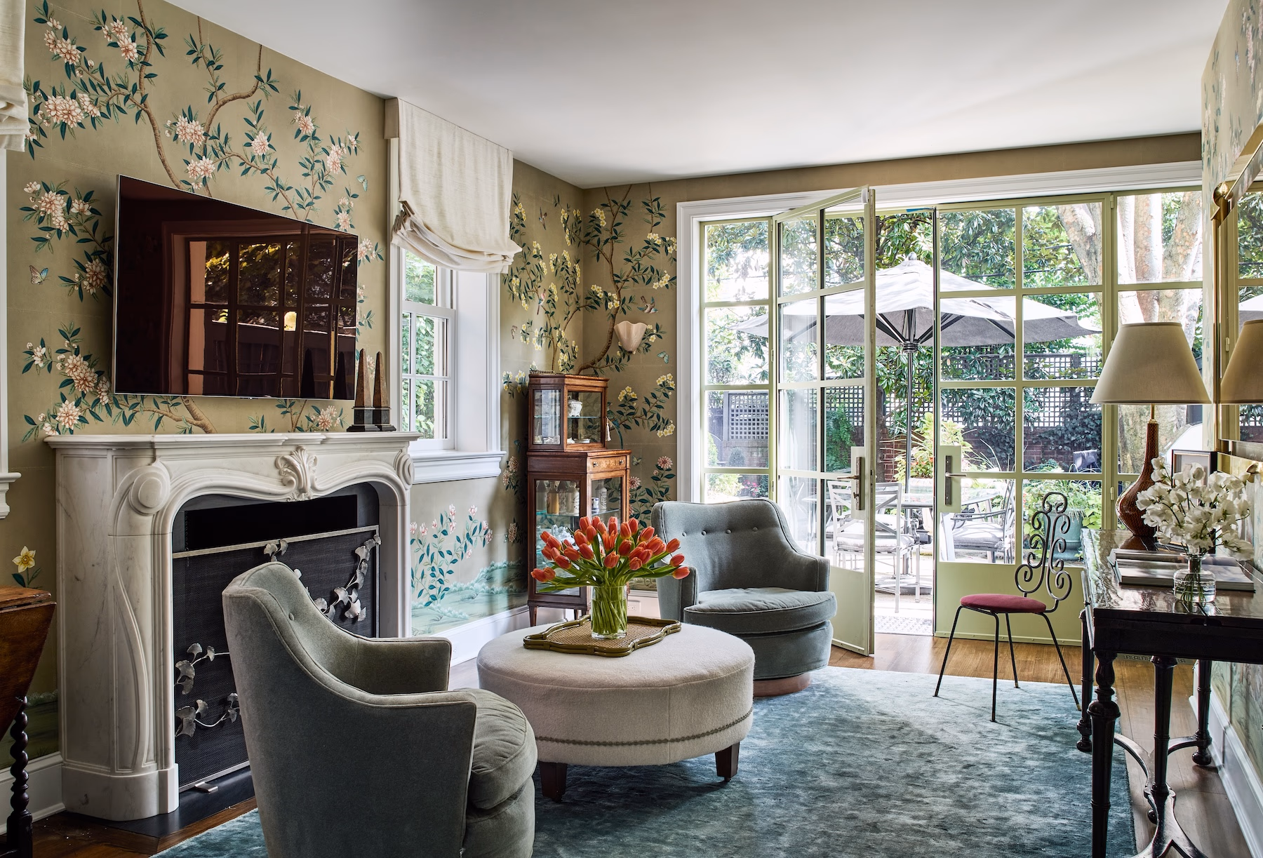 Rich, earthy colors, layered textures and rooms that tell a story are central to 2026. This historic Georgetown row house designed by Zoe Feldman has us daydreaming about adding a few of these trends to our own homes. Stacy Zarin Goldberg Photography - hand painted wallpaper