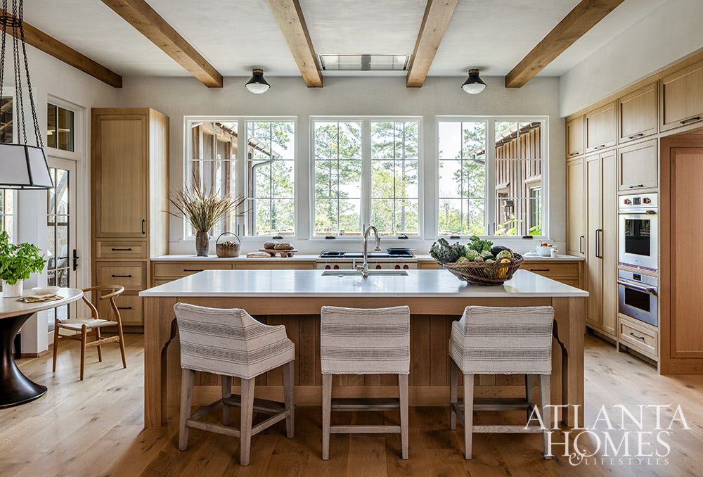 Favorite designers, Beth Webb  in collaboration with architect Heyward Russell Studio, inspire us at every turn - stained kitchen with island and wood beams