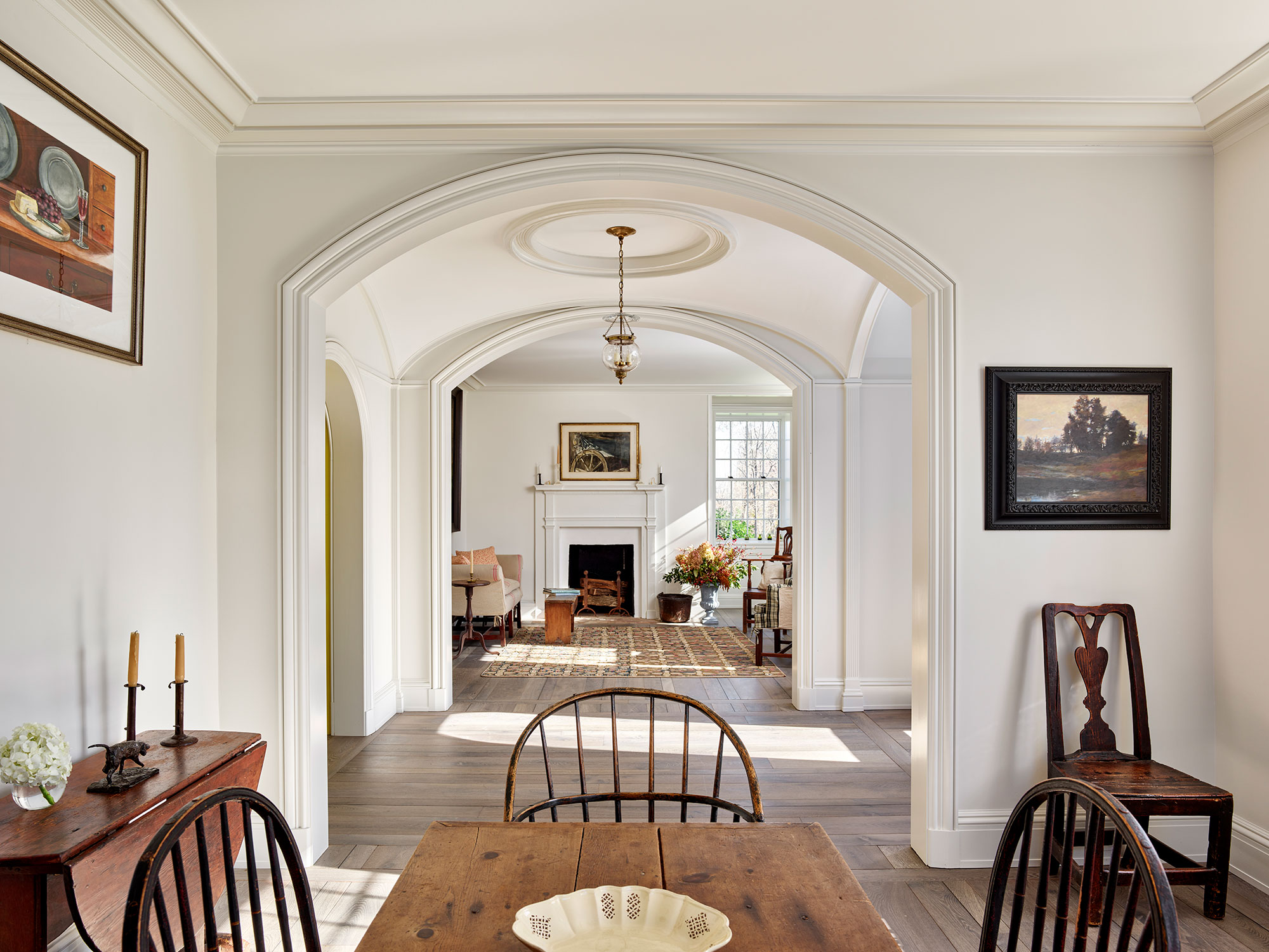 As the holidays come to an end, we hope you can steal away for a moment to take a peek at this gorgeous Archer & Buchanan Architecture designed home, photographed by Jeffrey Totaro and built by Griffiths Construction, Inc. This thoughtful restoration created a peaceful, calming home–with incredible views–that just might lend you a moment of serenity. Archer & Buchanan created a space that truly feels like a zen retreat, the perfect place to start a stress-free new year! Their designs are grounded in the past, designed for the present, and intended to be gorgeous and functional for family and friends to enjoy for years to come. Love the windsor chairs in the farmhouse dining room