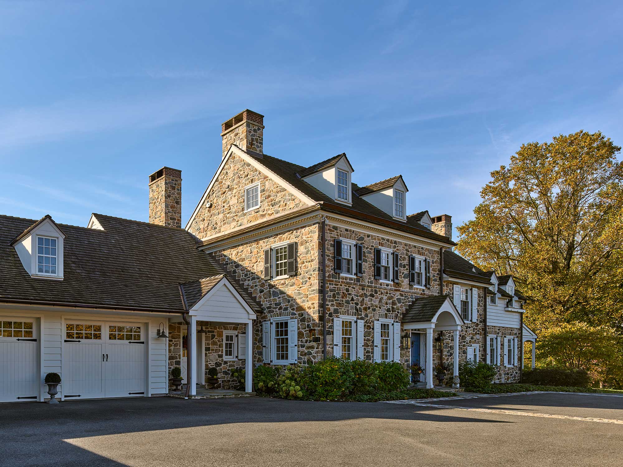 Such a stately 2 story stone home with 3 dormers by Archer and Buchanan ArchitectsBuilder: Cushing Custom Homes, Inc. | Landscape Architecture: Jonathan Alderson Landscape Architects | Interiors: Barbara Gisel Design | Photography: Jeffrey Totaro