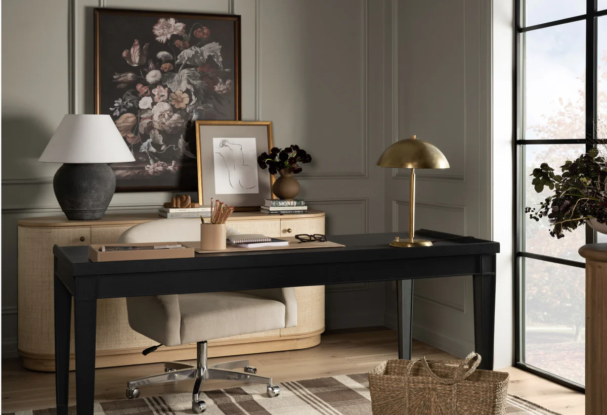 Not so long ago, white was the backdrop color used for creating a timeless, clean and fresh home. Today's white seems warmer, less crisp and more lived-in, now. Studio McGee Interiors | Lucy Call Photography - home office with a black desk and brass lamp 