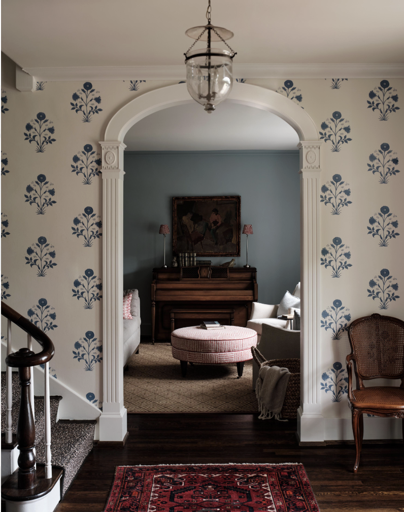 There was a time when open floor plans felt like the ultimate luxury. But lately, we have noticed a shift to rooms with a purpose. A wallpapered entry foyer with arched doorways and bell jar lantern -Sabbe Interior design | Joseph Bradshaw Photography