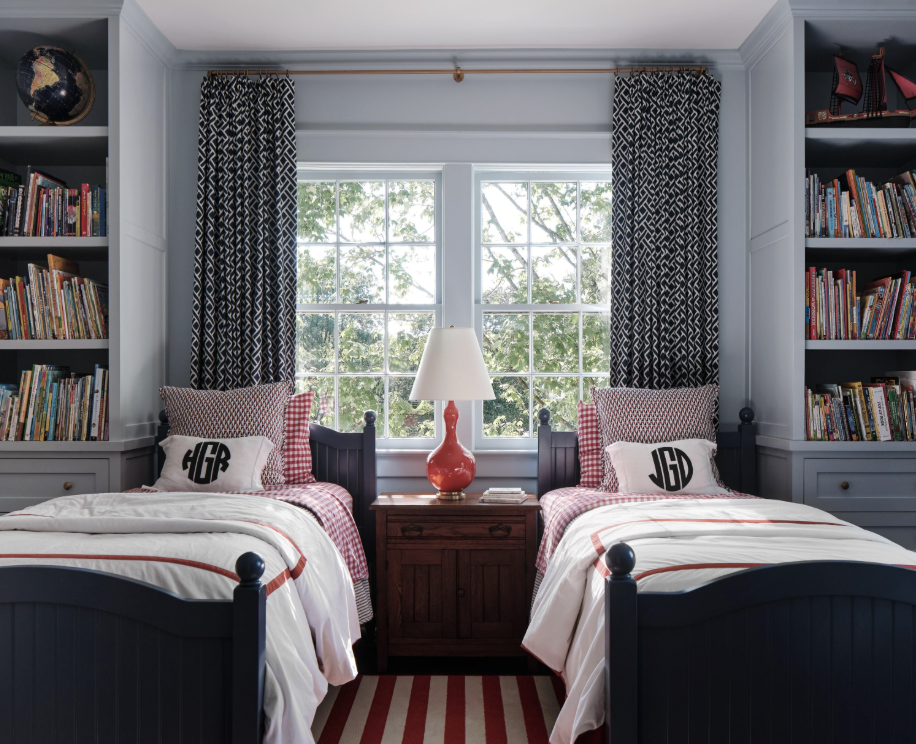 Sabbe Interior Design | Joseph Bradshaw Photography - love this boy's room with monogrammed bedd and bookcases flanking the twin beds
