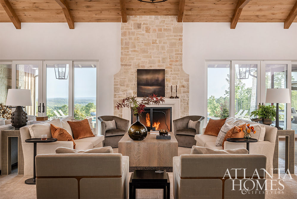avorite designers, Beth Webb  in collaboration with architect Heyward Russell Studio, inspire us at every turn - living room with stone fireplace and wood beam ceiling -Situated on 800 acres, this warm and welcoming family home is built with intention - not just for beauty but for living.