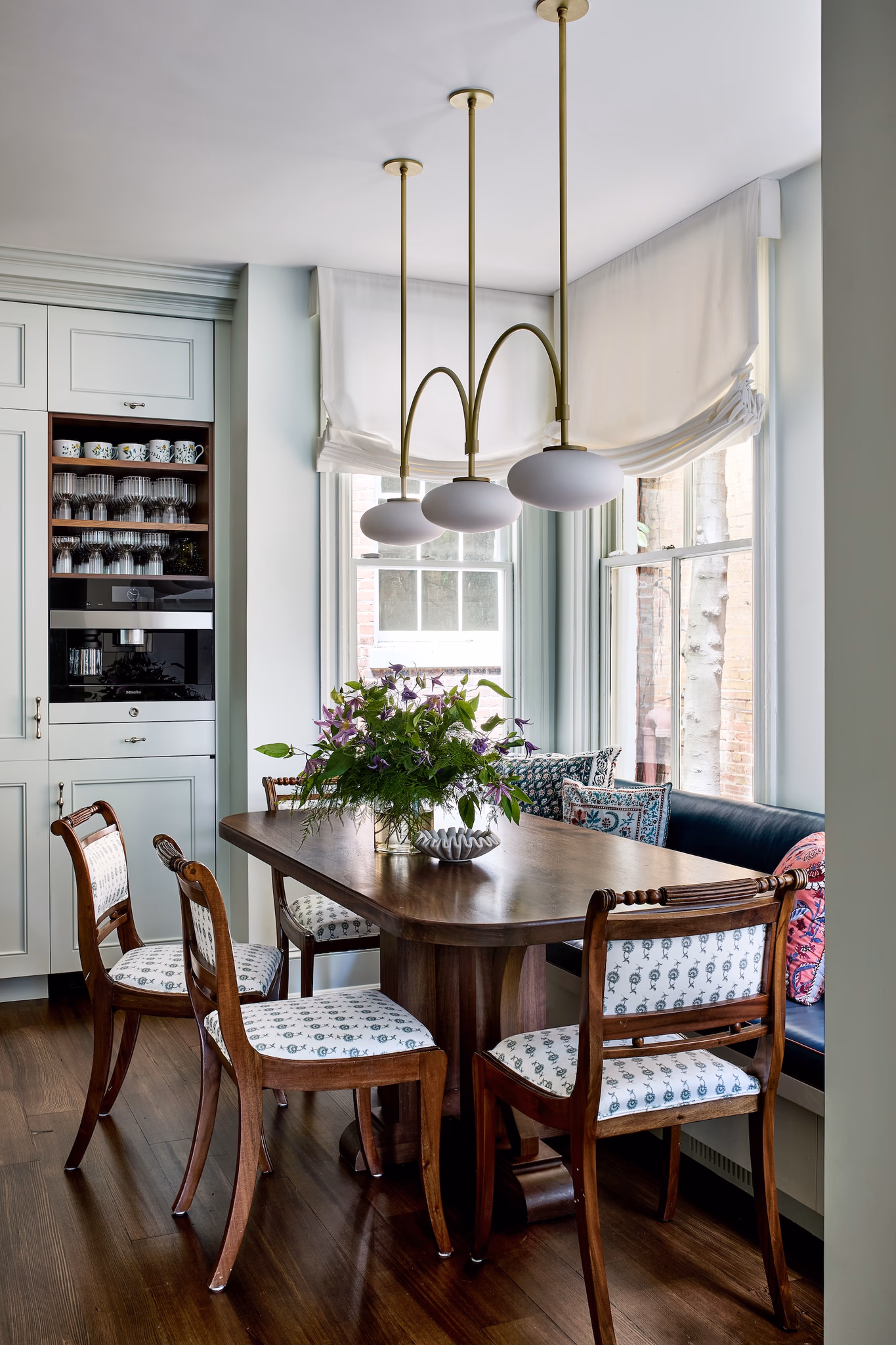 Rich, earthy colors, layered textures and rooms that tell a story are central to 2026 interior design trends. This historic Georgetown row house designed by Zoe Feldman has us daydreaming about adding a few of these trends to our own homes. Stacy Zarin Goldberg Photography Midcentury modern light fixture