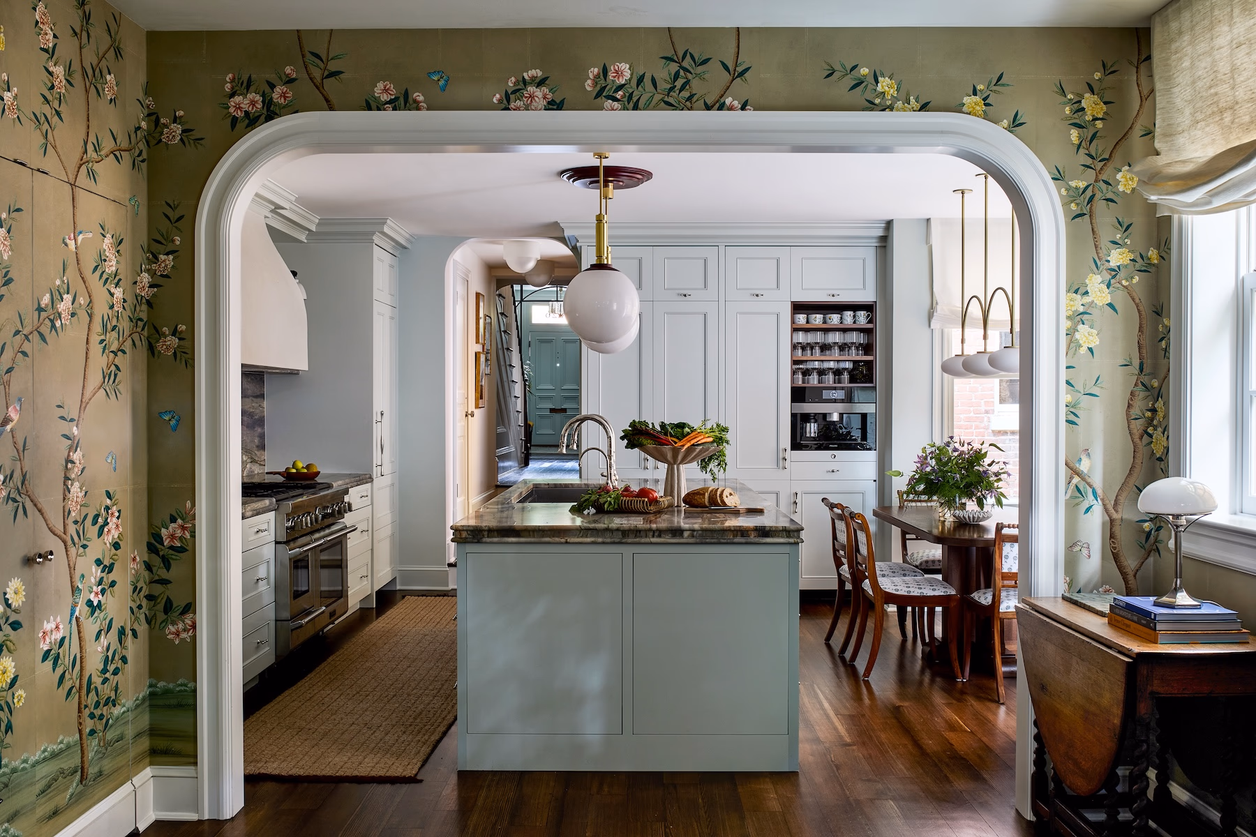 Rich, earthy colors, layered textures and rooms that tell a story are central to 2026. This historic Georgetown row house designed by Zoe Feldman has us daydreaming about adding a few of these trends to our own homes. Stacy Zarin Goldberg Photography - blue kitchen