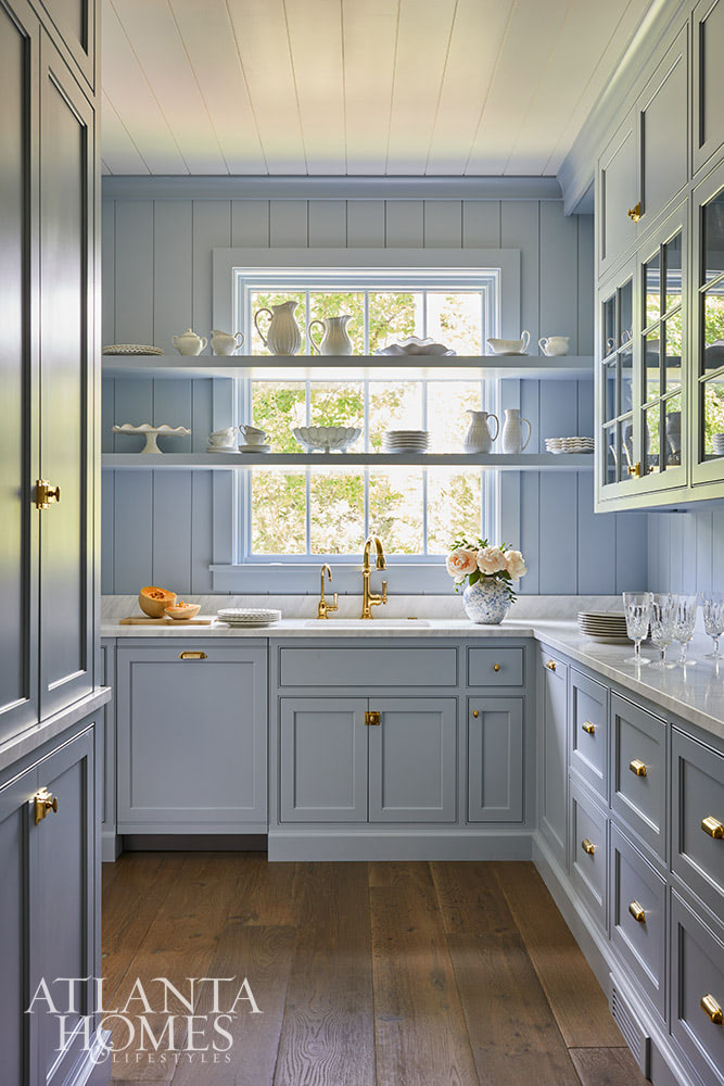 SOURCE; Atlanta Homes & Lifestyles INTERIOR DESIGN  Virginia Nocharli Design  ARCHITECT: Greg Busch Architects BUILDER Rhett Bonner, Bonner Buchanan  LANDSCAPE ARCHITECT  Richard Anderson Landscape Architect Blue butler's pantry with blue paneled walls and brass cabinet hardware