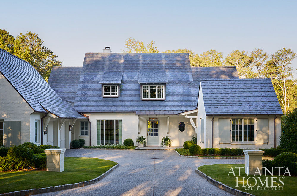 Exterior white modern mountain retreat with dormers SOURCE; Atlanta Homes & Lifestyles INTERIOR DESIGN  Virginia Nocharli Design  ARCHITECT: Greg Busch Architects BUILDER Rhett Bonner, Bonner Buchanan  LANDSCAPE ARCHITECT  Richard Anderson Landscape Architect
