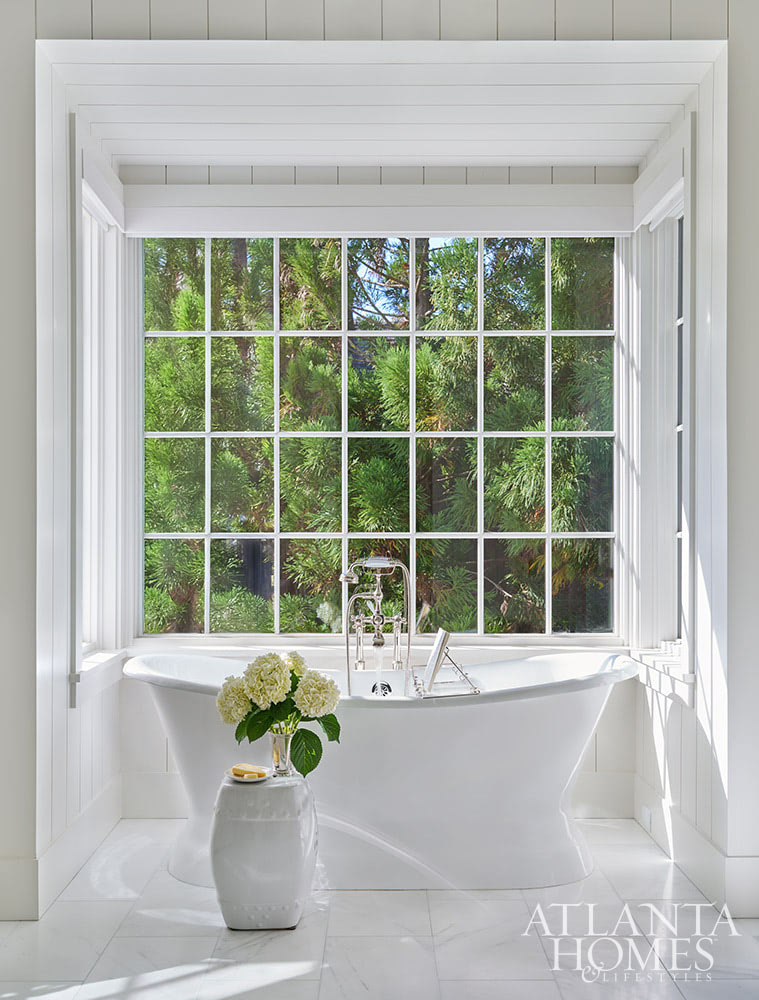 SOURCE; Atlanta Homes & Lifestyles INTERIOR DESIGN  Virginia Nocharli Design  ARCHITECT: Greg Busch Architects BUILDER Rhett Bonner, Bonner Buchanan  LANDSCAPE ARCHITECT  Richard Anderson Landscape Architect freestanding tub in a nook overlooking the beautiful yard