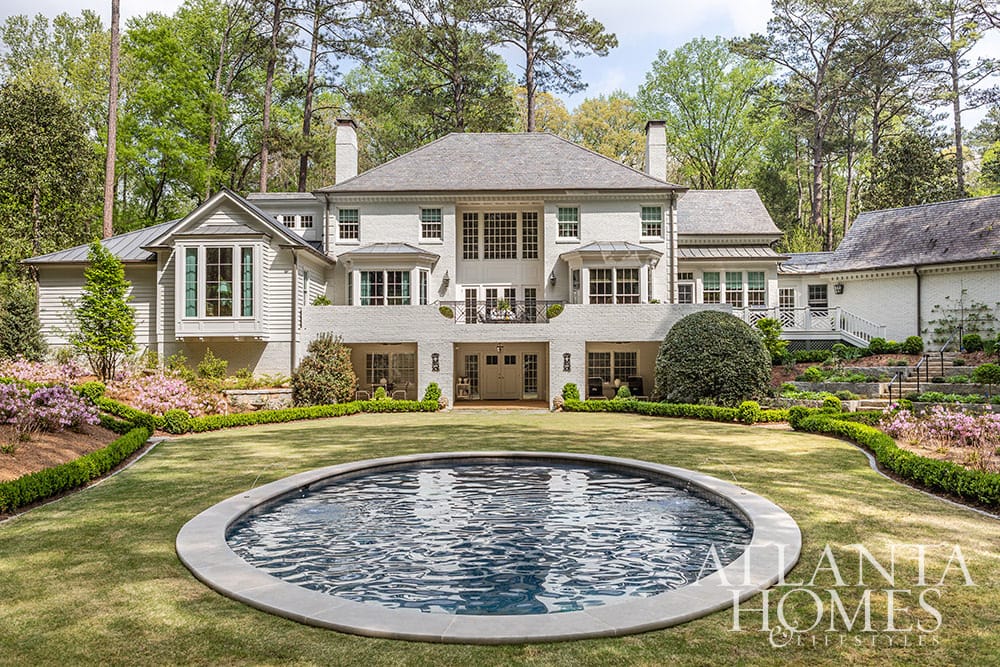 SOURCE: Atlanta Homes & Lifestyles  LANDSCAPE ARCHITECT Richard Anderson, Richard Anderson Landscape Architect - We don’t know about you, but we always love a good house tour.  To that end, Architect Norman Askins and Designer Chris Holt of Holt Interiors absolutely deliver. We are loving the sleek color palettes and sophisticated vibe of this stunning home–with pops of color in all the right places and the perfect dash of metallic chic. Whatever your design goals, you’ll find beautiful interior design ideas from this home in Atlanta Homes & Lifestyles to get your day started on the right foot! CONTRACTOR Duncan Spears, Eumenean Construction - beautiful roud pool in this backyard with boxwoods and azaleas