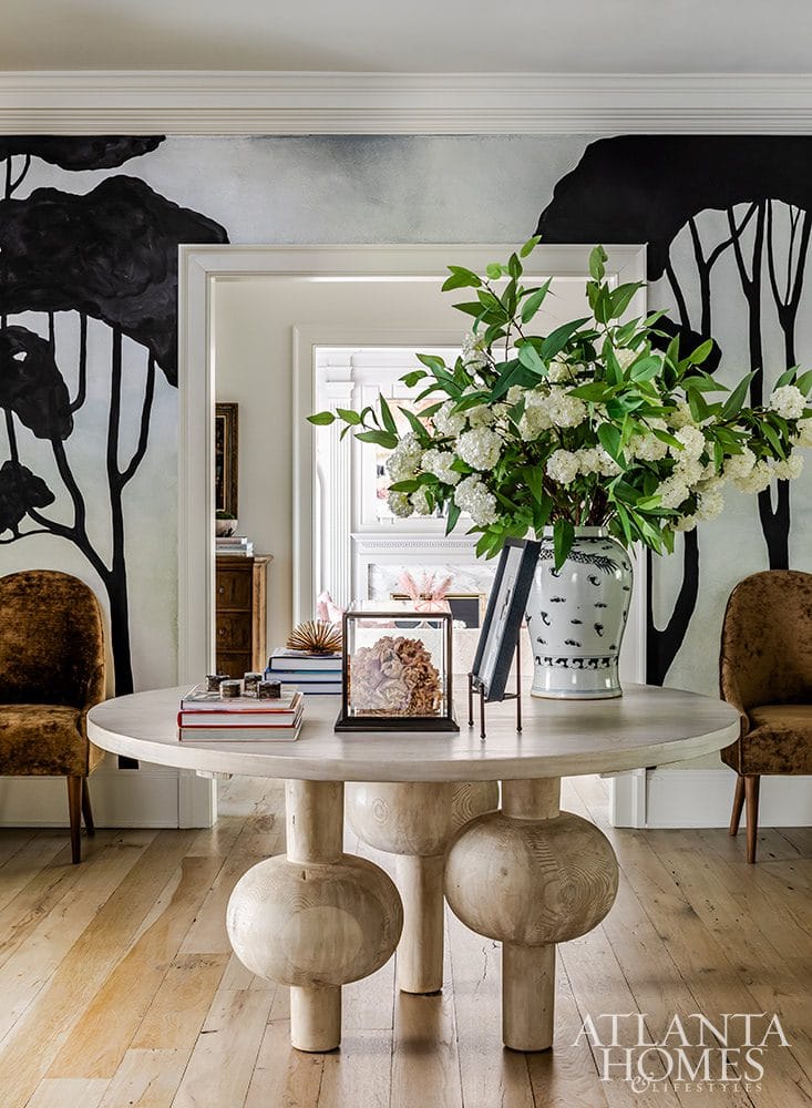 Atlanta Homes & Lifestyles | Kristan Moore Design | Jeff Herr Photography In the homes we've featured on Design Chic with the most memorable style, one unexpected decision creates this unforgettable foyer.  It's all about restraint - one thoughtful piece that adds balance and style, that perfectly anchors the space.