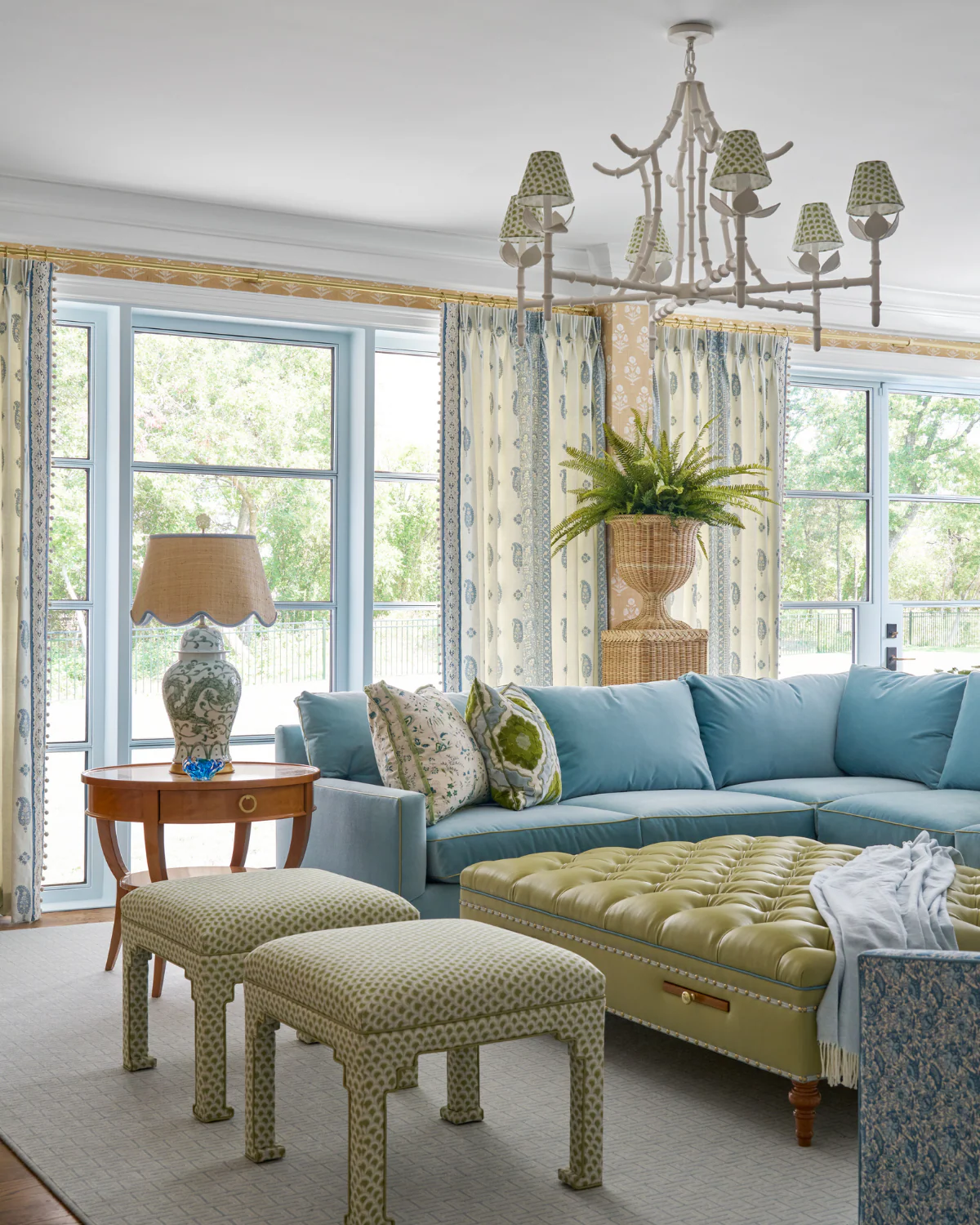 We hope you are having a fabulous day. We are so excited to share this gorgeous home designed by Dunbar Road Design with inspiring interior design ideas for your own home. Full of charm and character, it's the perfect place for entertaining or for family relaxation. Nathan Schroder Photography - blue and white living room with sectional sofa and tufted ottoman in green leather