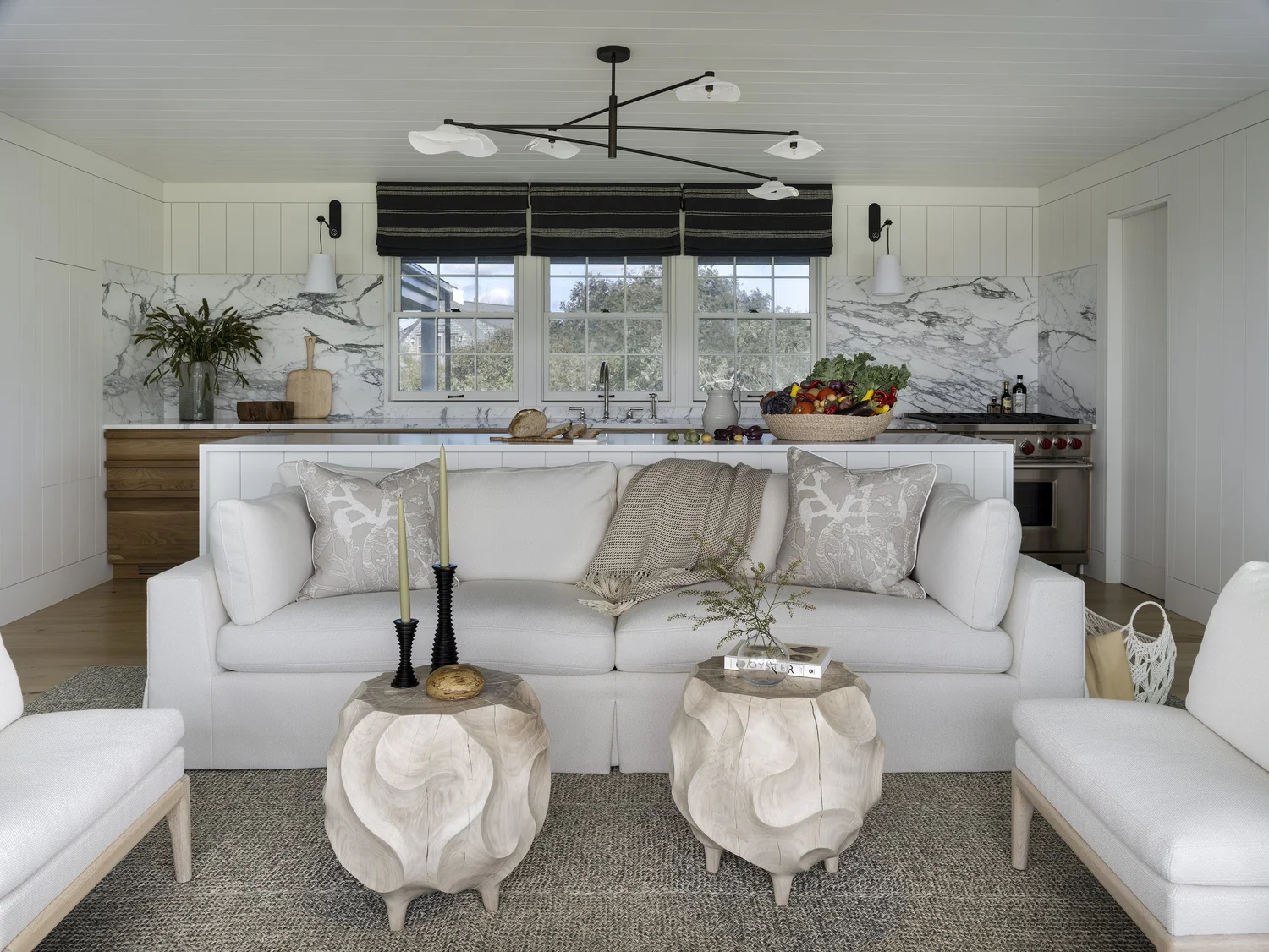 We hope you are having a great week–and are in the mood for touring a stunning Nantucket coastal home designed by the talented Honey Collins Interiors and beautifully photographed by Alison Gootee Photography.  Neutral enough to be calm, textured enough to be interesting, and layered into complete coziness, this is the perfect home for friends and family.  Whatever your design goals, you’ll find the inspiration to get your home makeover started on the right foot! Happy Thursday! neutral living room - white furniture with open concept living room kitchen 