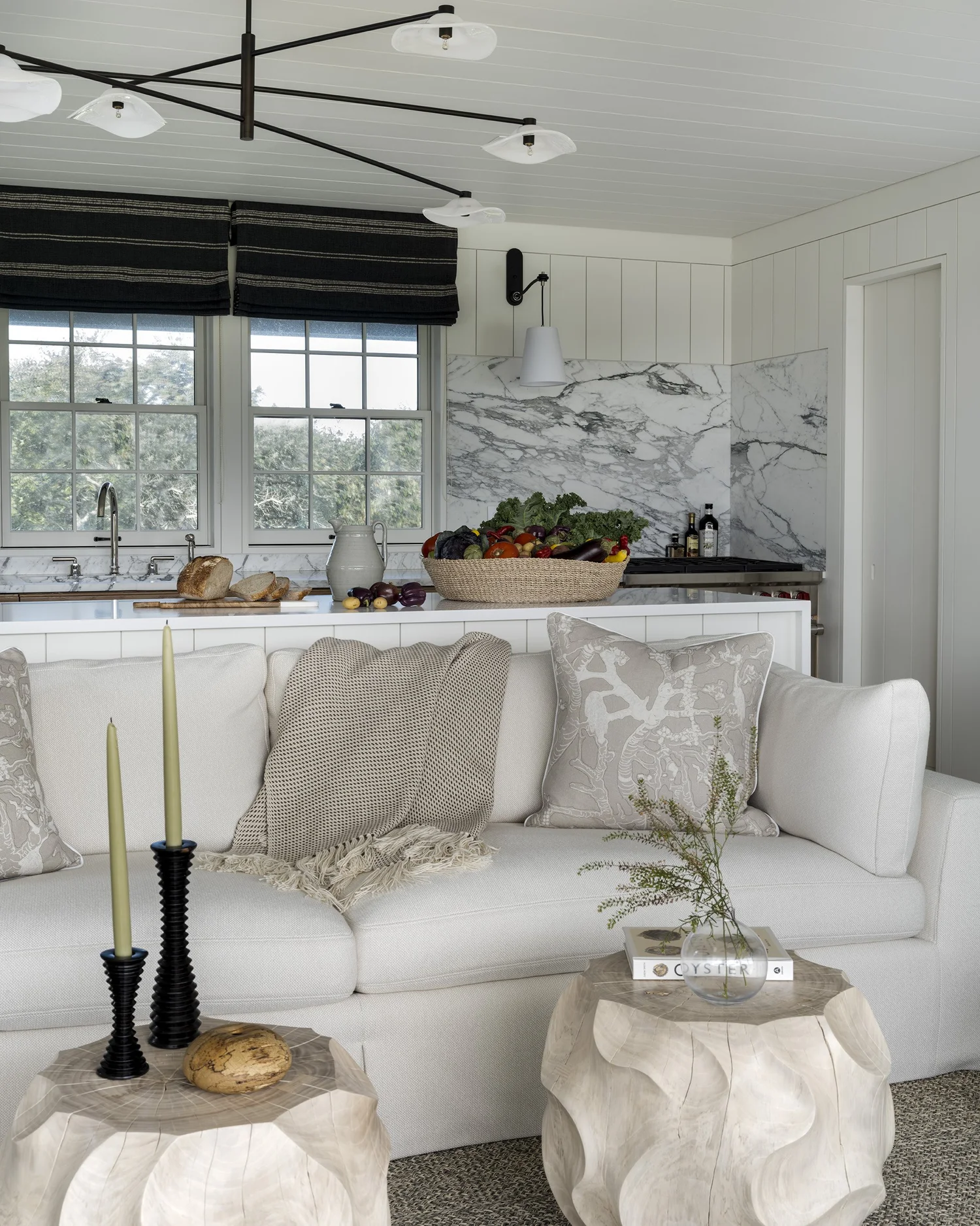  We hope you are having a great week–and are in the mood for touring a stunning Nantucket coastal home designed by the talented Honey Collins Interiors and beautifully photographed by Alison Gootee Photography.  Neutral enough to be calm, textured enough to be interesting, and layered into complete coziness, this is the perfect home for friends and family.  Whatever your design goals, you’ll find the inspiration to get your home makeover started on the right foot! Happy Thursday!- white kitchen with marble backsplash and countertops