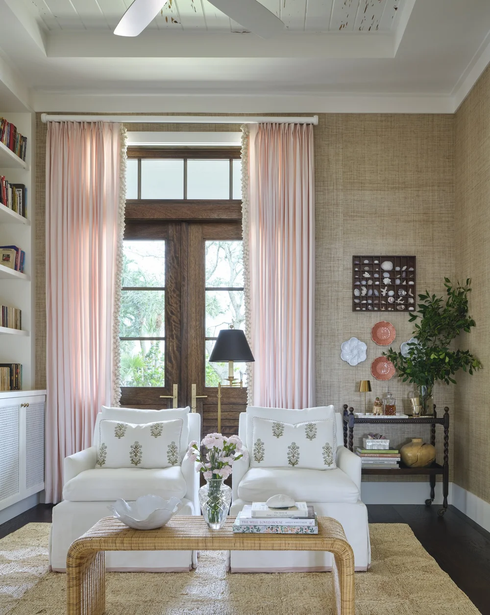 We hope you are having a great week–and are in the mood for touring a one-of-a-kind home designed by the talented Kara Miller and beautifully photographed by Brantley Photography. Neutral enough to be calm, textured enough to be interesting, and layered into complete coziness, this perfectly styled home is ideal for friends and family. Adore the pink draperies with the neutral grasscloth in this family room