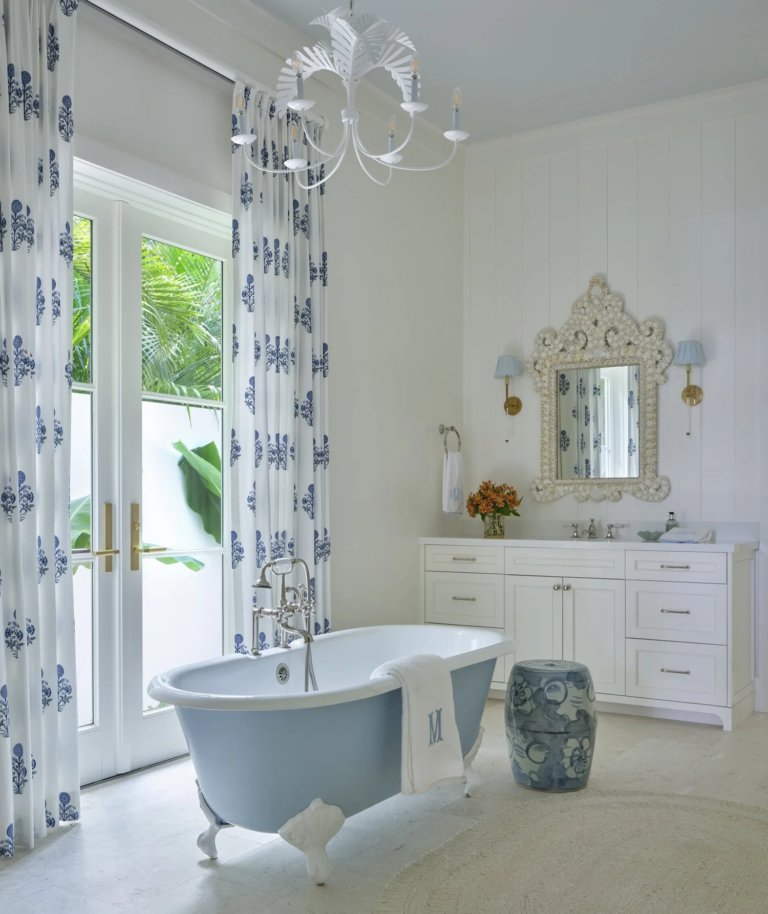 We hope you are having a great week–and are in the mood for touring a one-of-a-kind home designed by the talented Kara Miller and beautifully photographed by Brantley Photography. Neutral enough to be calm, textured enough to be interesting, and layered into complete coziness, this home is ideal for friends and family.Beautiful blue and white bathroom with blue and white clawfoot tub