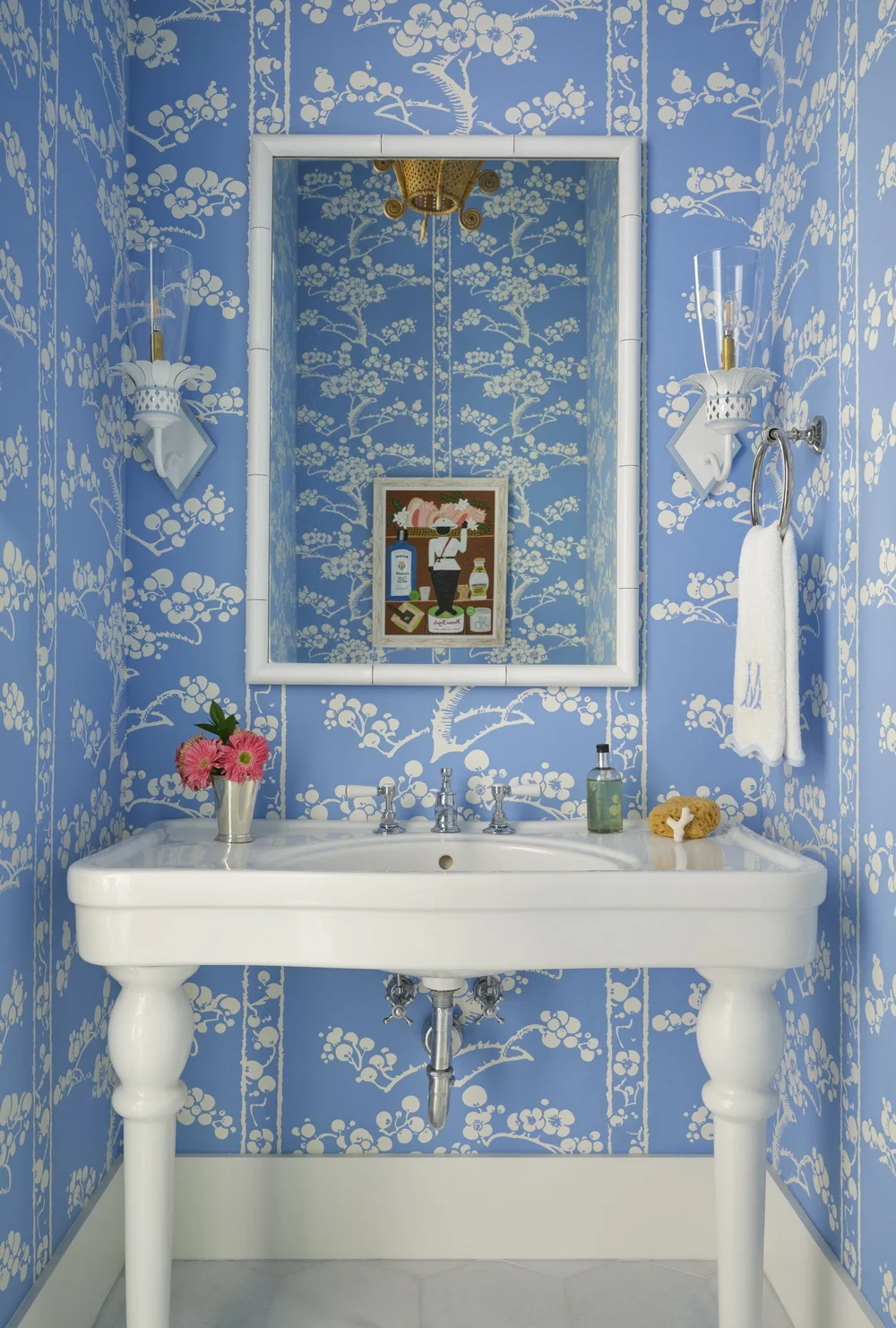 We hope you are having a great week–and are in the mood for touring a one-of-a-kind home designed by the talented Kara Miller and beautifully photographed by Brantley Photography. Neutral enough to be calm, textured enough to be interesting, and layered into complete coziness, this home is ideal for friends and family.Beautiful blue and white powder bathroom - love the blue and white wallpaper