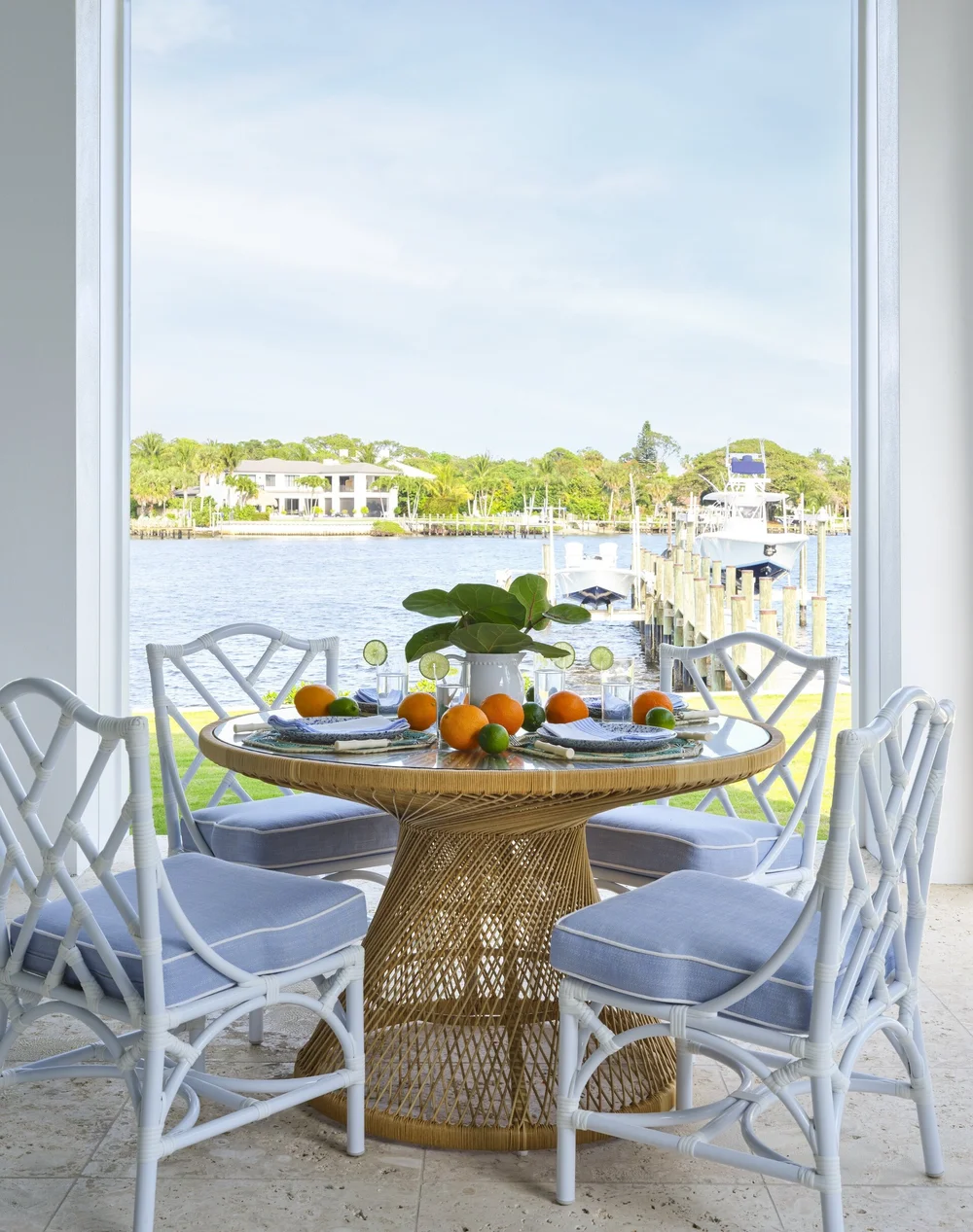 We hope you are having a great week–and are in the mood for touring a one-of-a-kind home designed by the talented Kara Miller and beautifully photographed by Brantley Photography. Neutral enough to be calm, textured enough to be interesting, and layered into complete coziness, this home is ideal for friends and family.Beautiful blue and white dining nook overlooking the water