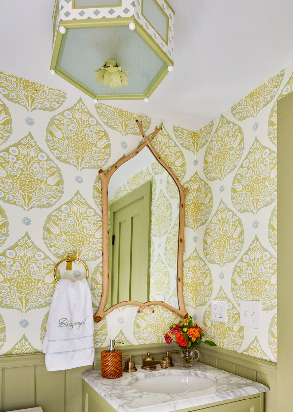 If so, you’re in for a treat today. Todays historic Catskill home designed by the talented team at Amanda Reynal Interiors is a refuge from the fast pace of modern life.   Charming and livable with lush surroundings and even lusher interiors, this home will make you feel a world away without ever leaving your living room. Thomas Loof Photography - love the bathroom with green and white wallpaper and bamboo mirror