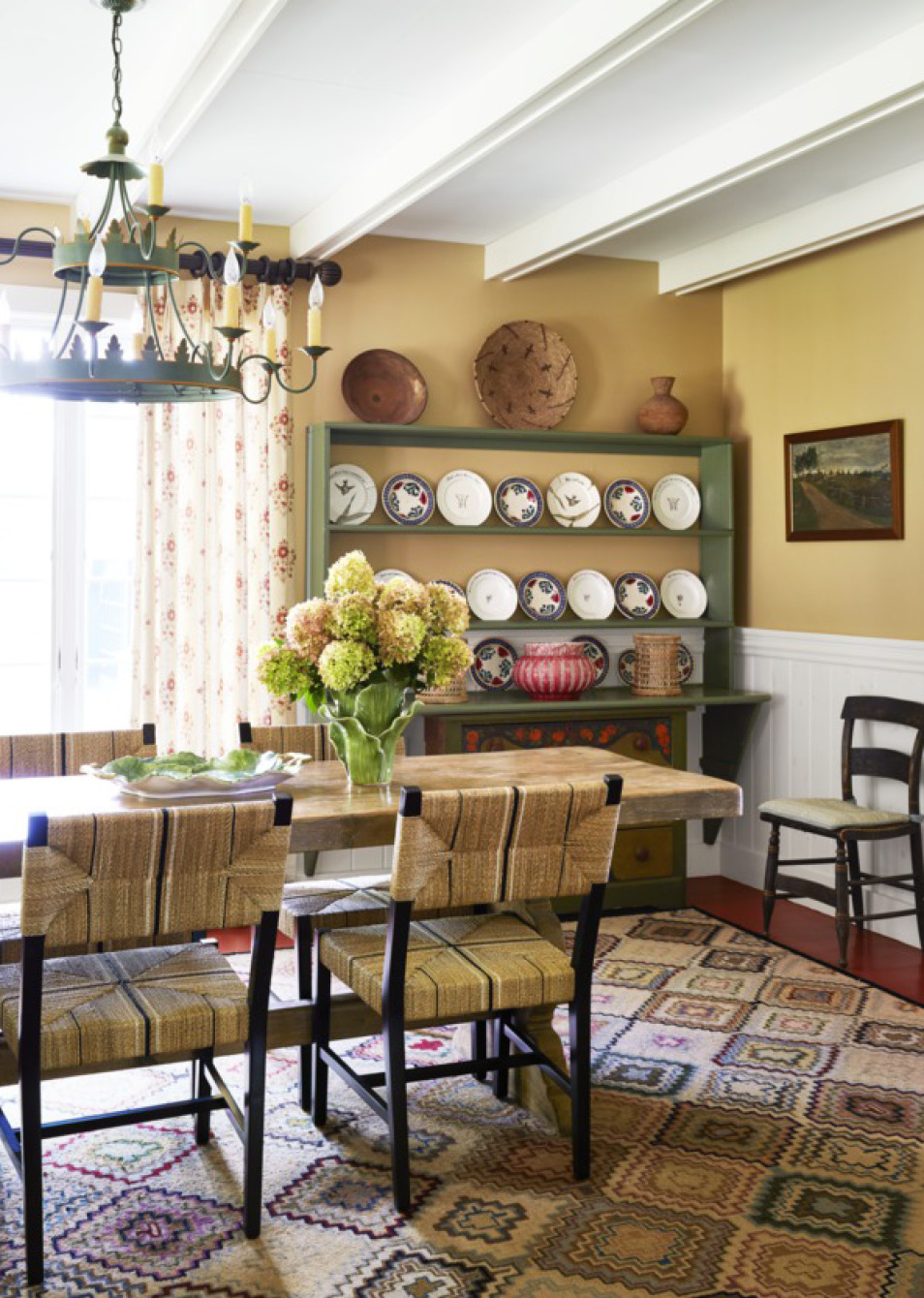 If so, you’re in for a treat today. Todays historic Catskill cottage tour designed by the talented team at Amanda Reynal Interiors is a refuge from the fast pace of modern life.   Charming and livable with lush surroundings and even lusher interiors, this home will make you feel a world away without ever leaving your living room. Thomas Loof Photography - casual dining room 