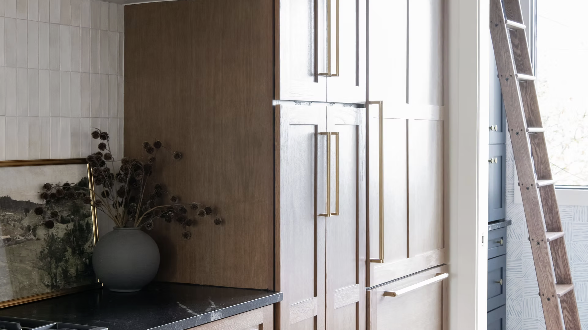 Chic, clean interior design ideas with just the right amount of personality are hallmarks of this talented designer’s style. Take a break, take a peek, and let us know which space of Cerminara Designs is your favorite! chic stained kitchen with with gorgeous library ladder -Allison Elefante Photography