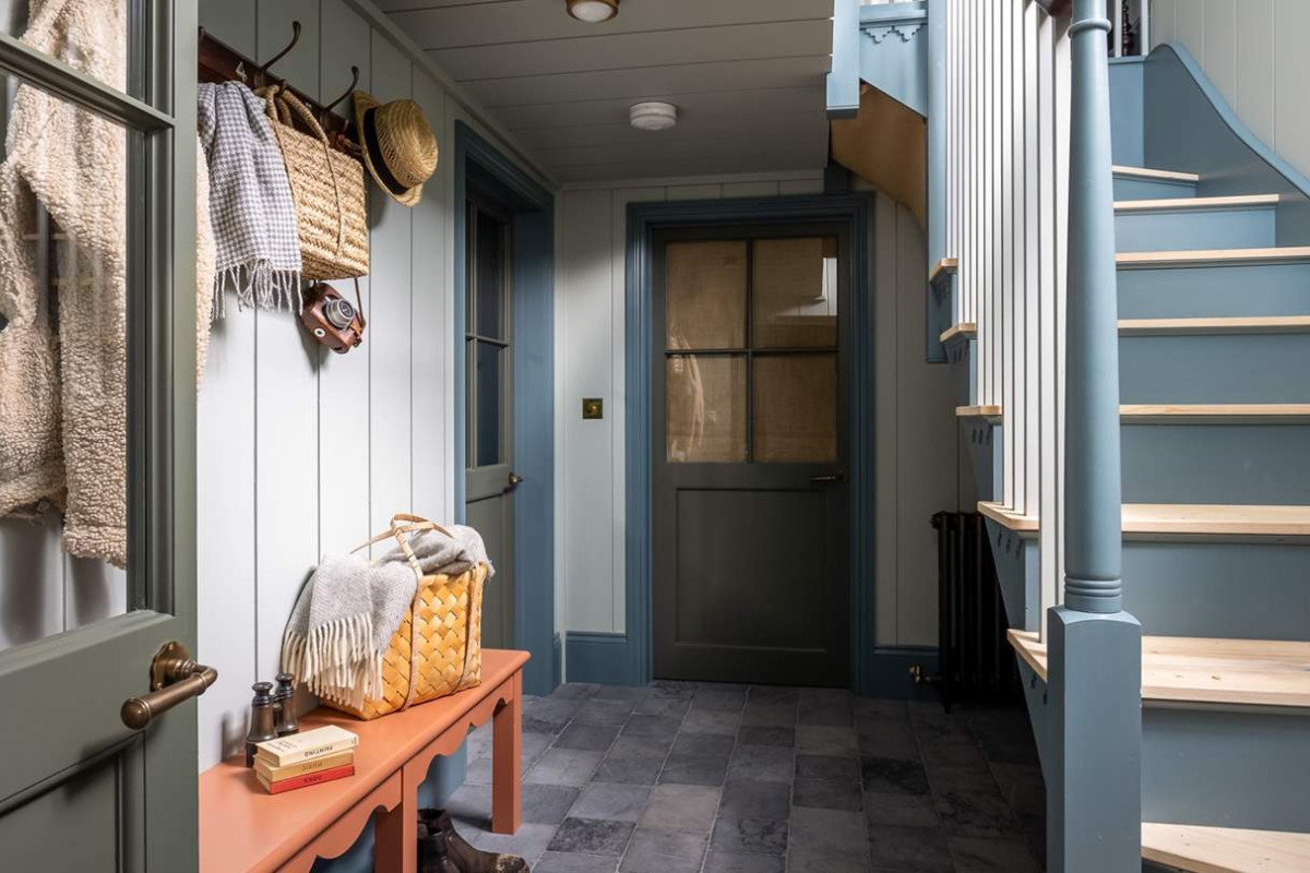 Ham Interiors - Alexander James Photography - mudroom with shiplap walls and hanging hat rack and bench below