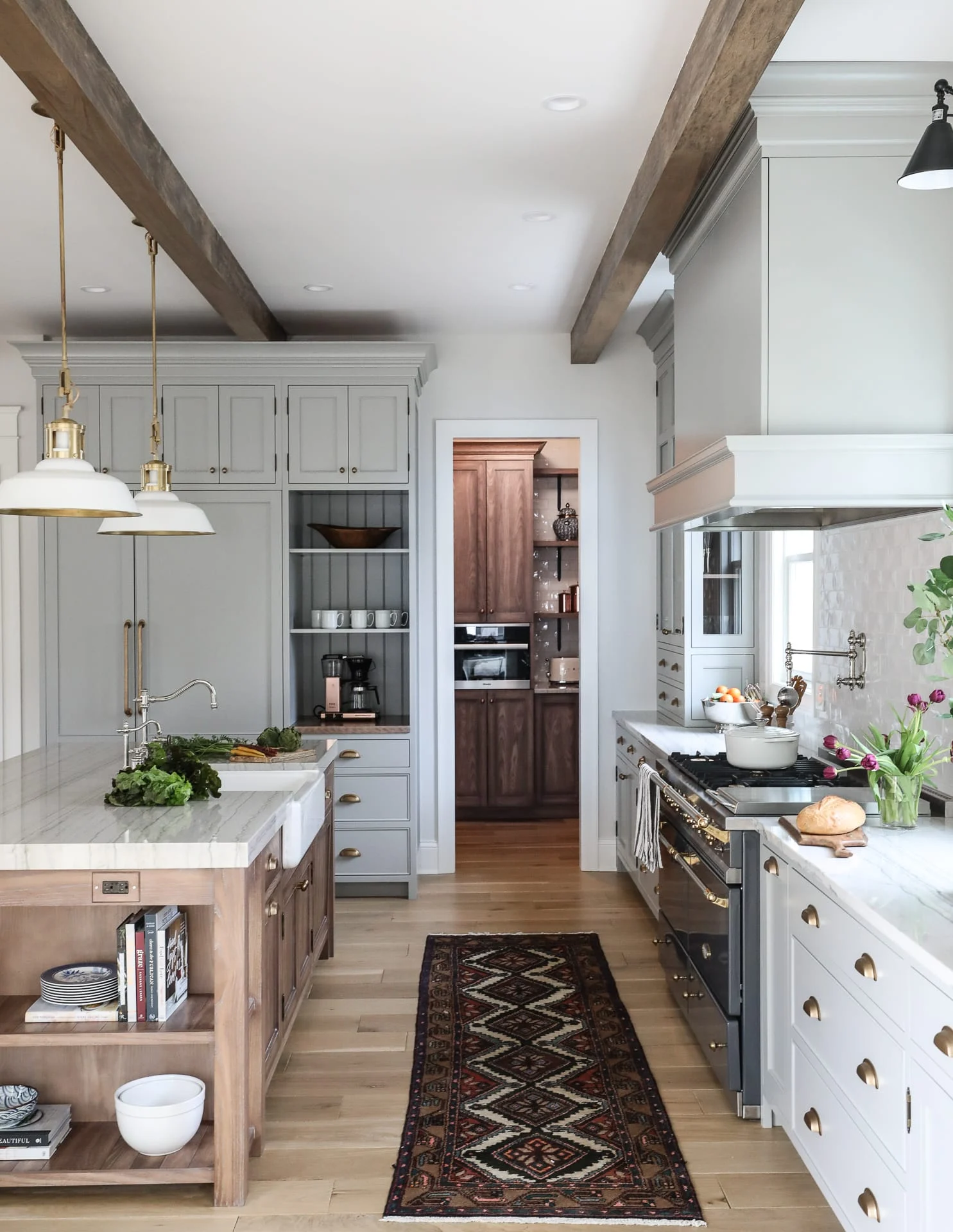 For many years, all white kitchens were the choice for designers, and color and texture were added with decor and table settings. White kitchens are not going away, but the shift towards warmer tones is all the rage, as shown in these fabulous looks from Park and Oak Design.