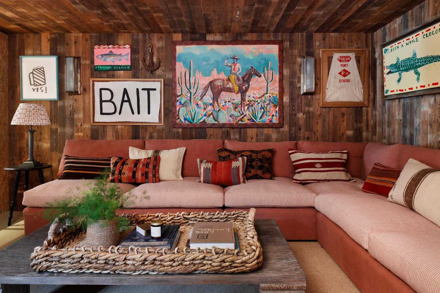 Ham Interiors - Alexander James Photography - charming fisherman's cottage with stained living room with sectional sofa and gallery wall above