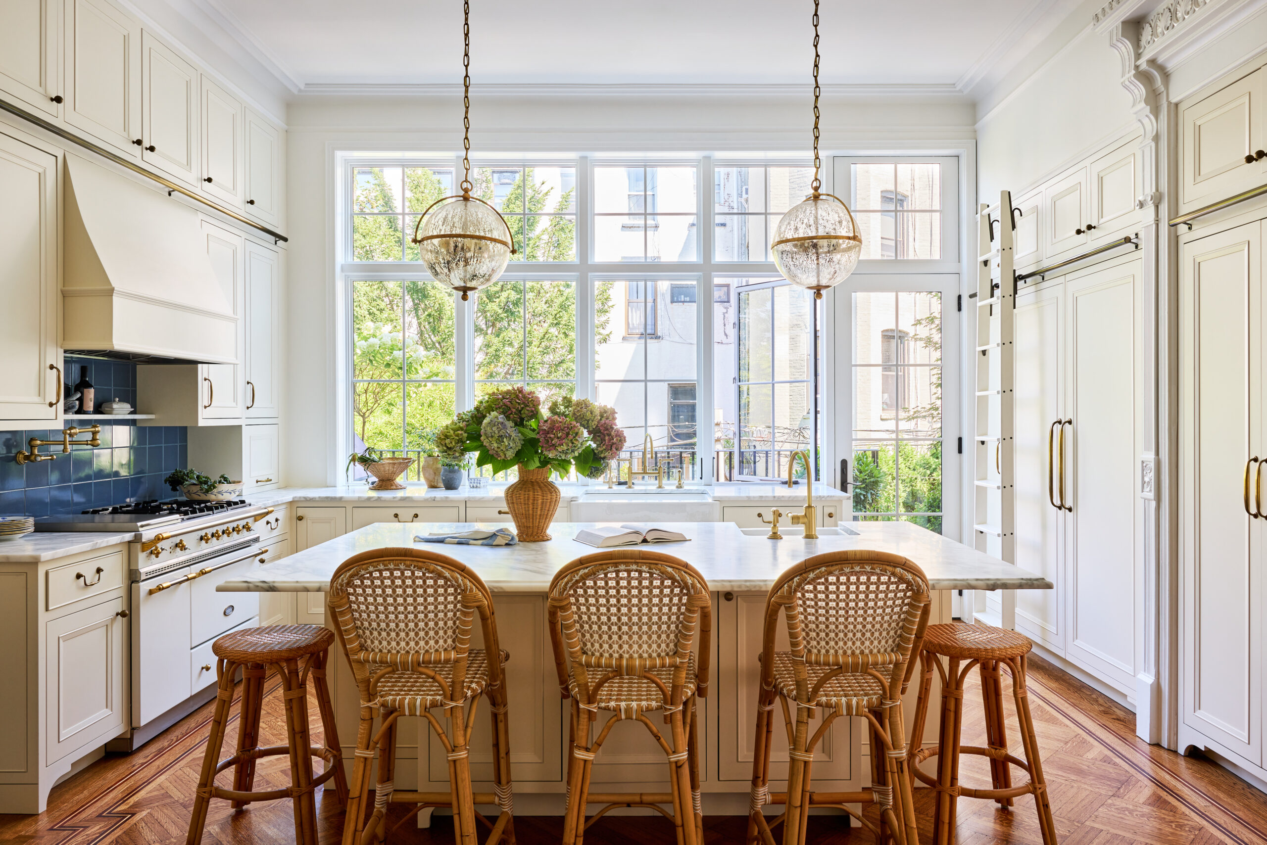 Kristen Francis Photography | Frances Bailey Stylist - kitchen with rattan stools and pendant lights over island