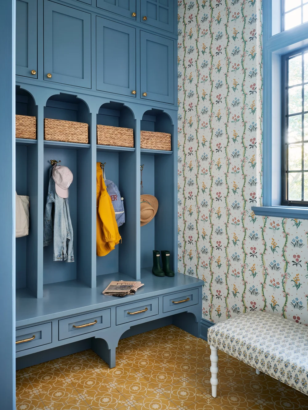 You'll love how Jenkins Interiors - Stephen Karlish Photography - moody blue mudroom with open shelves and charming wallpaper