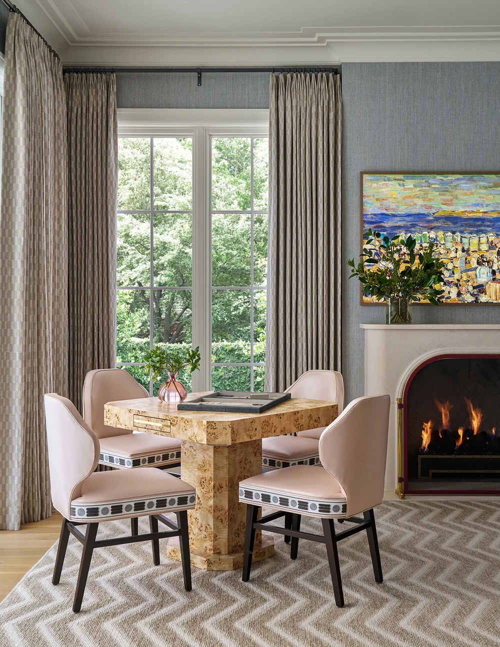 In a world full of minimalism and clean lines, traditional design is making a quiet comeback. It’s the perfect mix of classic touches and updated details, well-suited for family living and entertaining. Where stunning moldings and architectural details live comfortably with more casual room. Mary Beth Wagner Interior Design - Nathan Schroder Photography - game table with 4 pink chairs