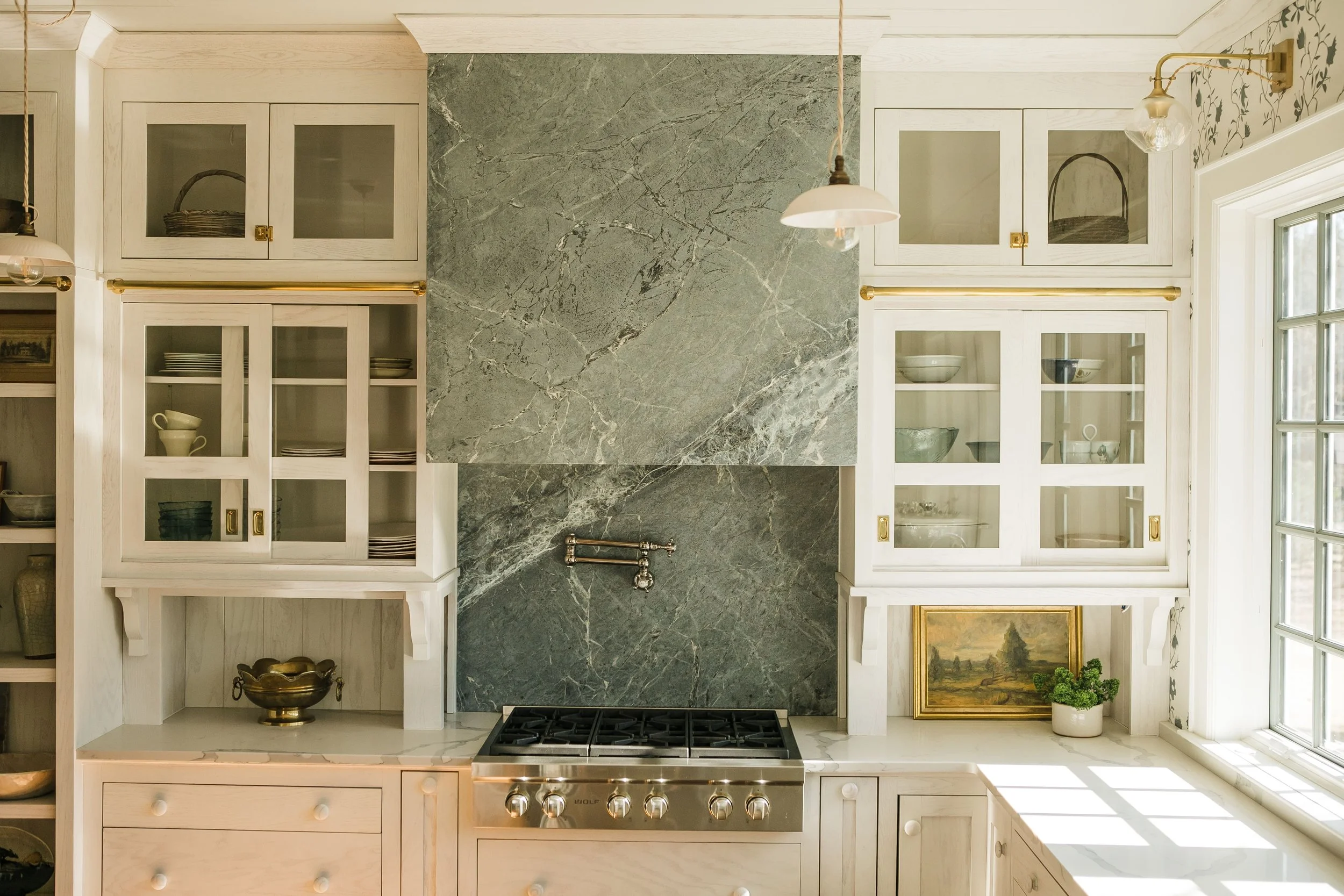 Creating a charming kitchen requires thoughtful design and an effortless style. In this Misfit House designed kitchen, Monica Stewart achieves both! Kristin Karch Photography @kristinkarchphoto - Love the stainless range hood and brass fittings