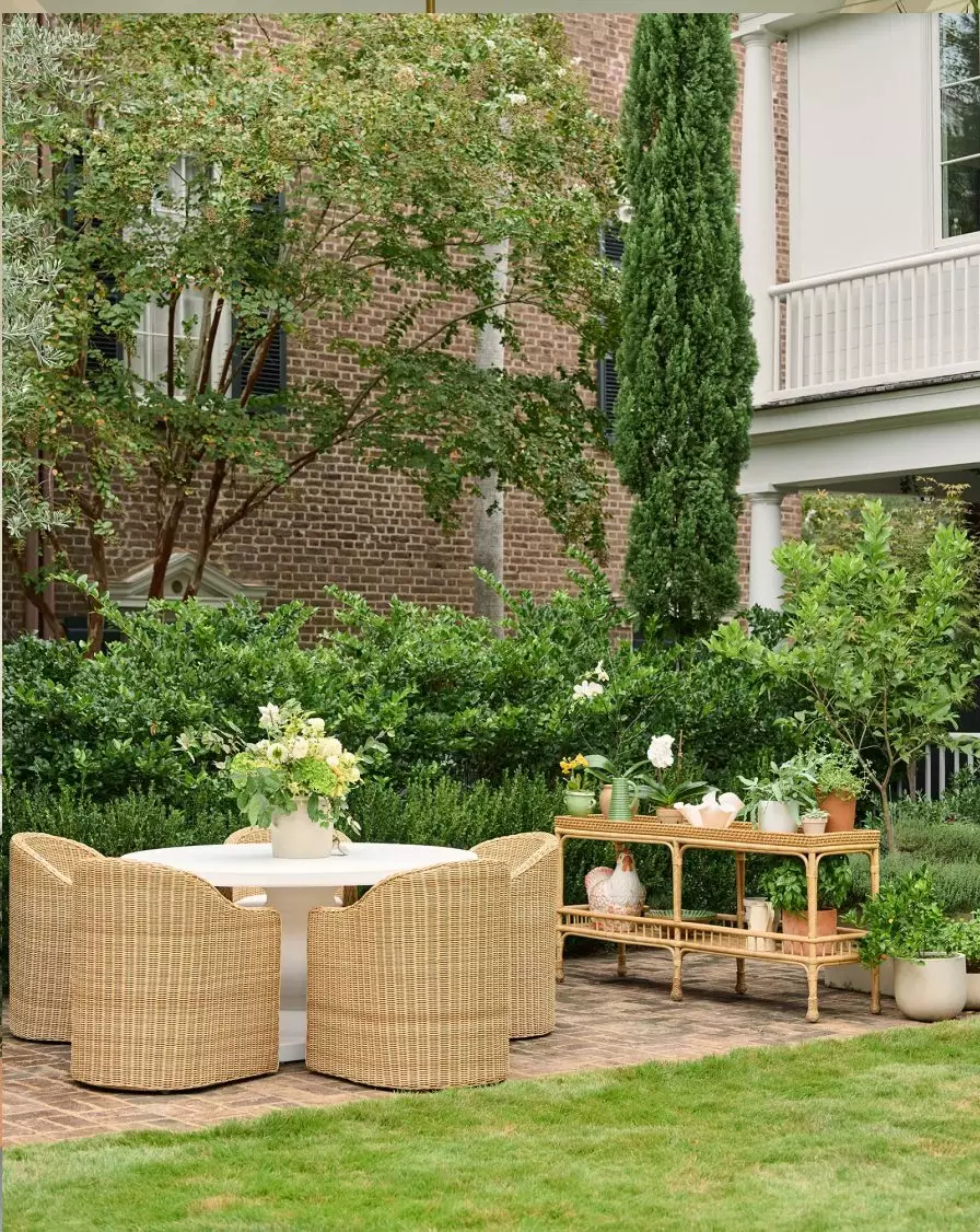 Love the round outdoor dining table with wicker chairs - Take a look at favorite inspiration from Serena & Lily! Love the wicker lantern over the dining table with wicker chairs