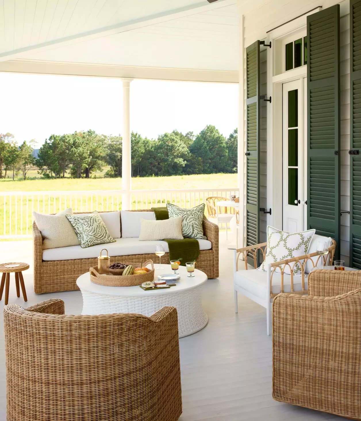 Outdoor entertaining are one of our favorite things about this fabulous season. Take a look at favorite inspiration from Serena & Lily! Love the wicker lantern over the dining table with wicker chairs - covered porch with outdoor living room