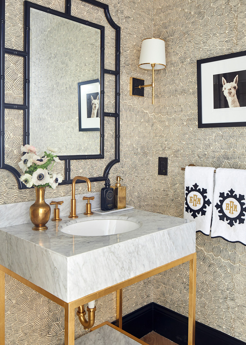 Warm, inviting, and completely livable, we adore this Amanda Reynal designed home, beautifully photographed by Adam Albright! Step inside and then take another peek so you don't miss a single detail! - love the navy blue Serena and Lily Mirror in the powder room with the Schumacher wallpaper