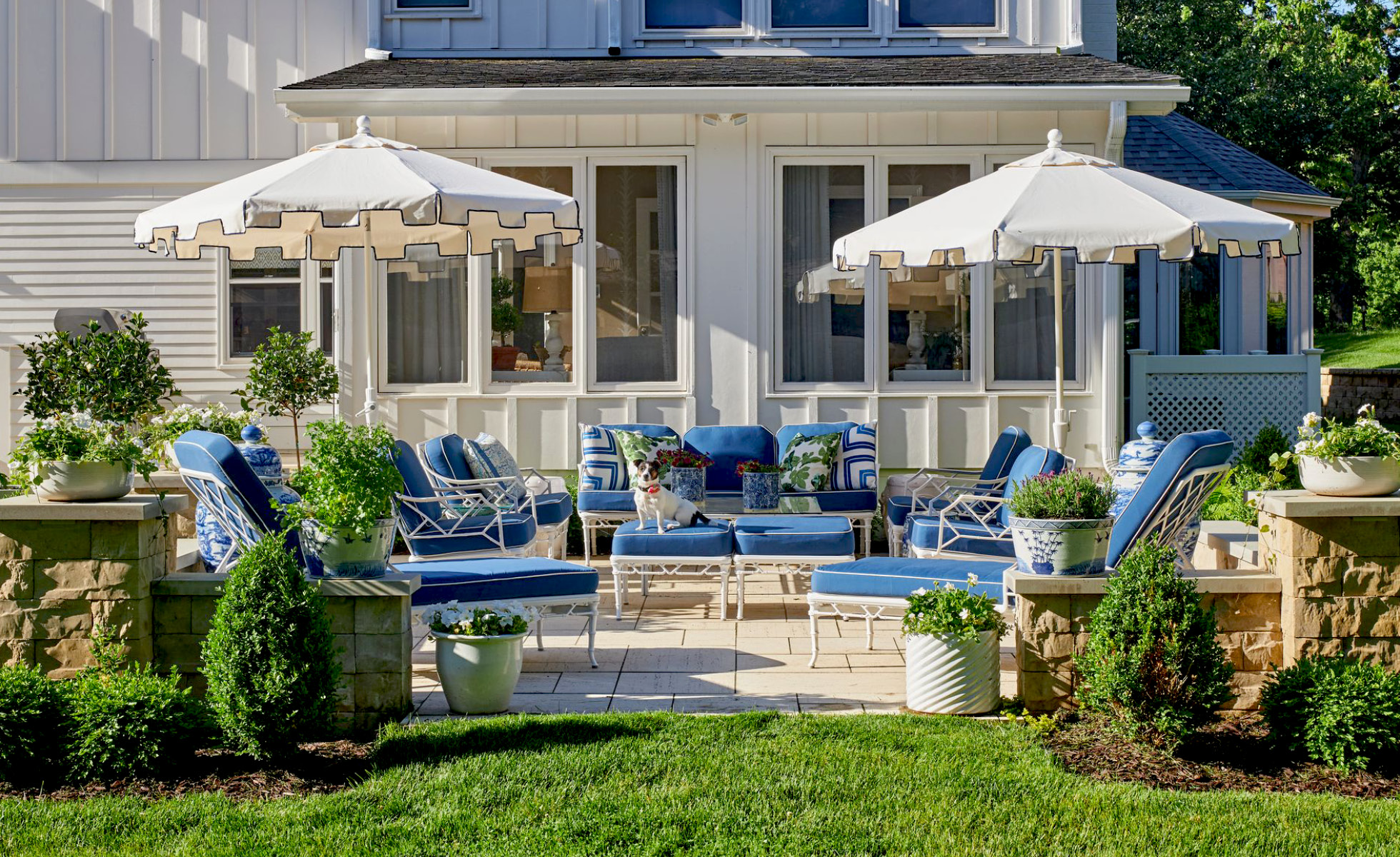 Warm, inviting, and completely livable, we adore this Amanda Reynal designed home, beautifully photographed by Adam Albright! Step inside and then take another peek so you don't miss a single detail! the patio with blue cushions and white umbrellas is the perfect spot for morning coffee