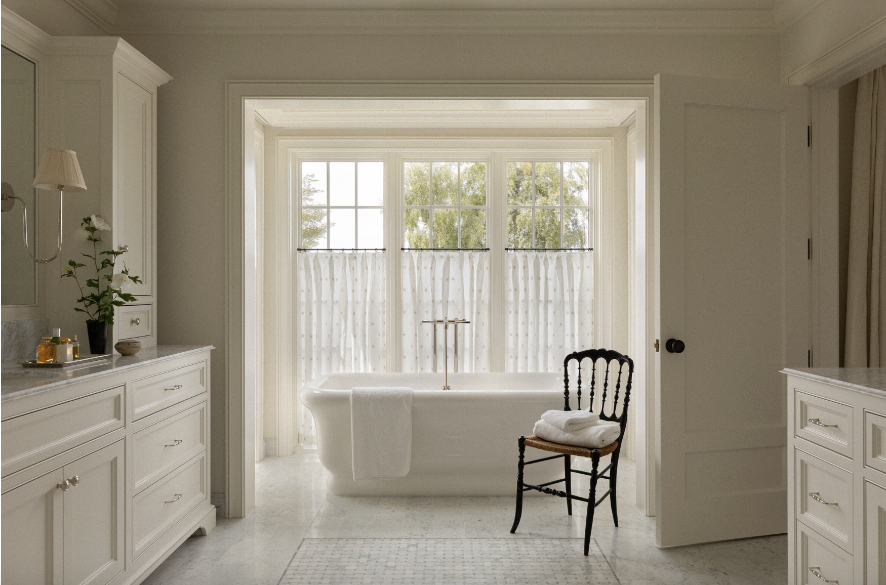 Beauty, sophistication, and attention to detail are just a few of the things that come to mind when we think of Marianne Simon Interiors' beautiful designs. It’s those little things that we think make Simon’s work shine the very most - neutral bathroom with freestanding tub