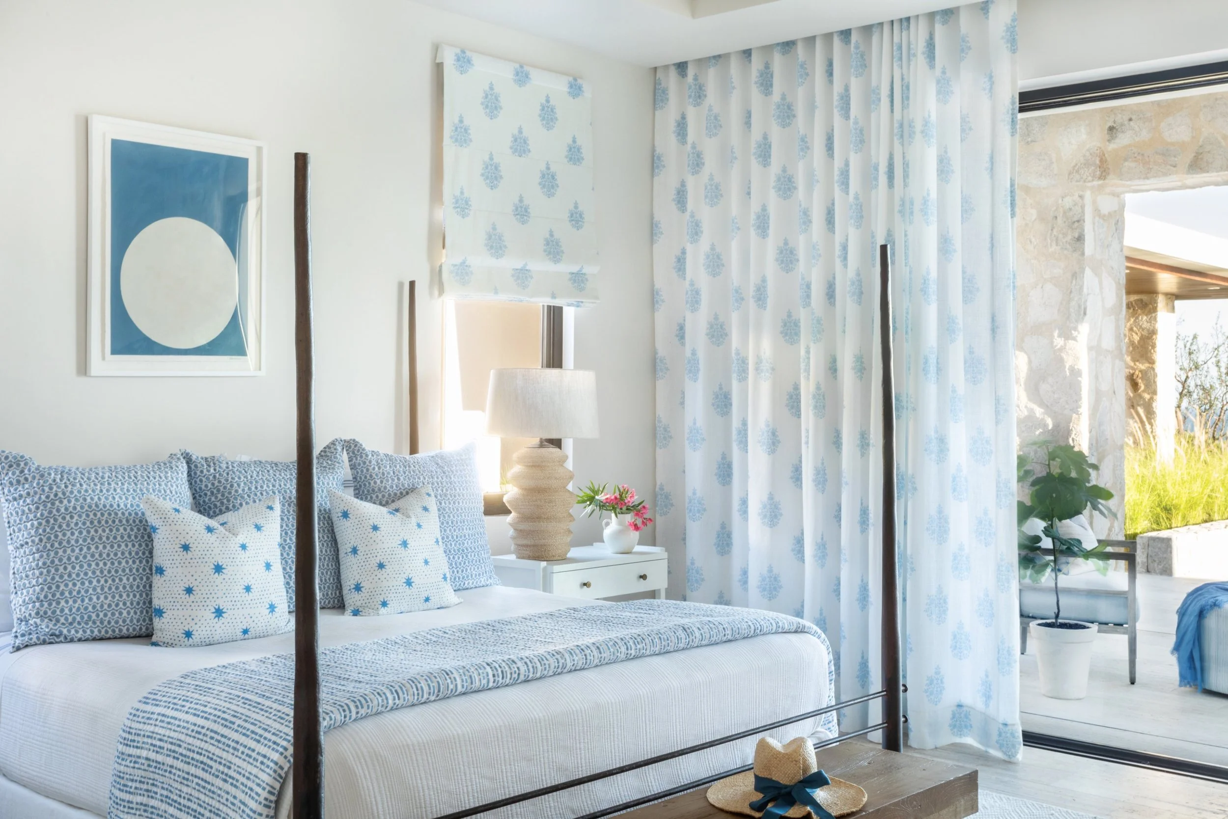  A. Wooten Interiors.   Photography: Heidi Harris - love the blue and white bedroom with the wooden 4 poster bed and bench at the end