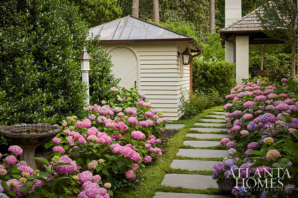 Source Atlanta Homes & Lifestyles | Interior Design by Andrea Henzlik Design  | Architect Greg Busch Architects | Photographed by Emily Followill | Styled by Eleanor Roper  | Landscape Architect Carson McElheney, Hamilton Land Services Inc | Builder Roger Balko - stone pathway to gorgeous gardens